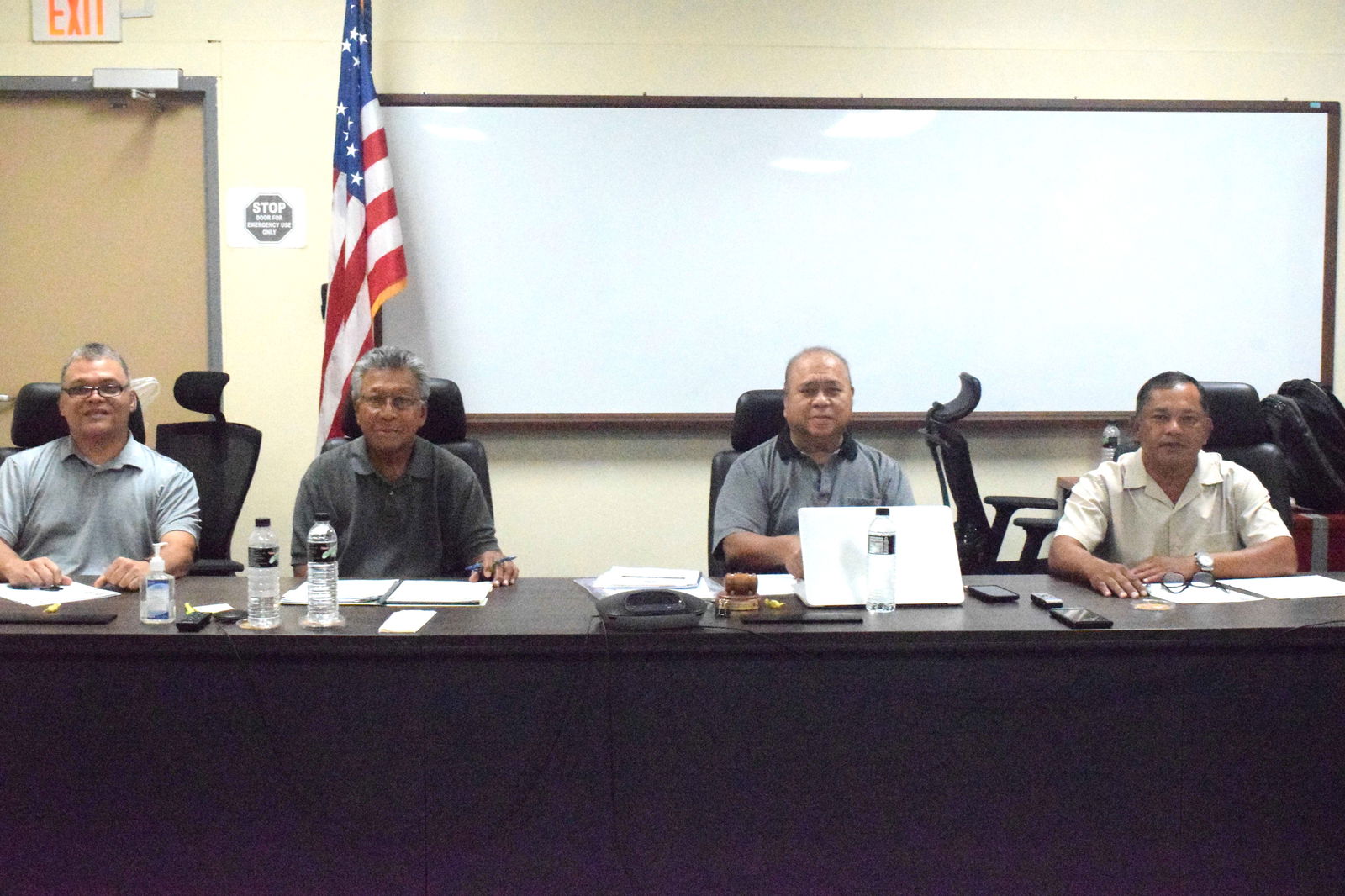 Commonwealth Casino Commission Chair Edward C. Deleon Guerrero, center, Vice Chair Ralph S. Demapan, right, Commissioners Thomas A. Manglona, left, and Mario Taitano pose for a photo during their last meeting of the year on Friday.
