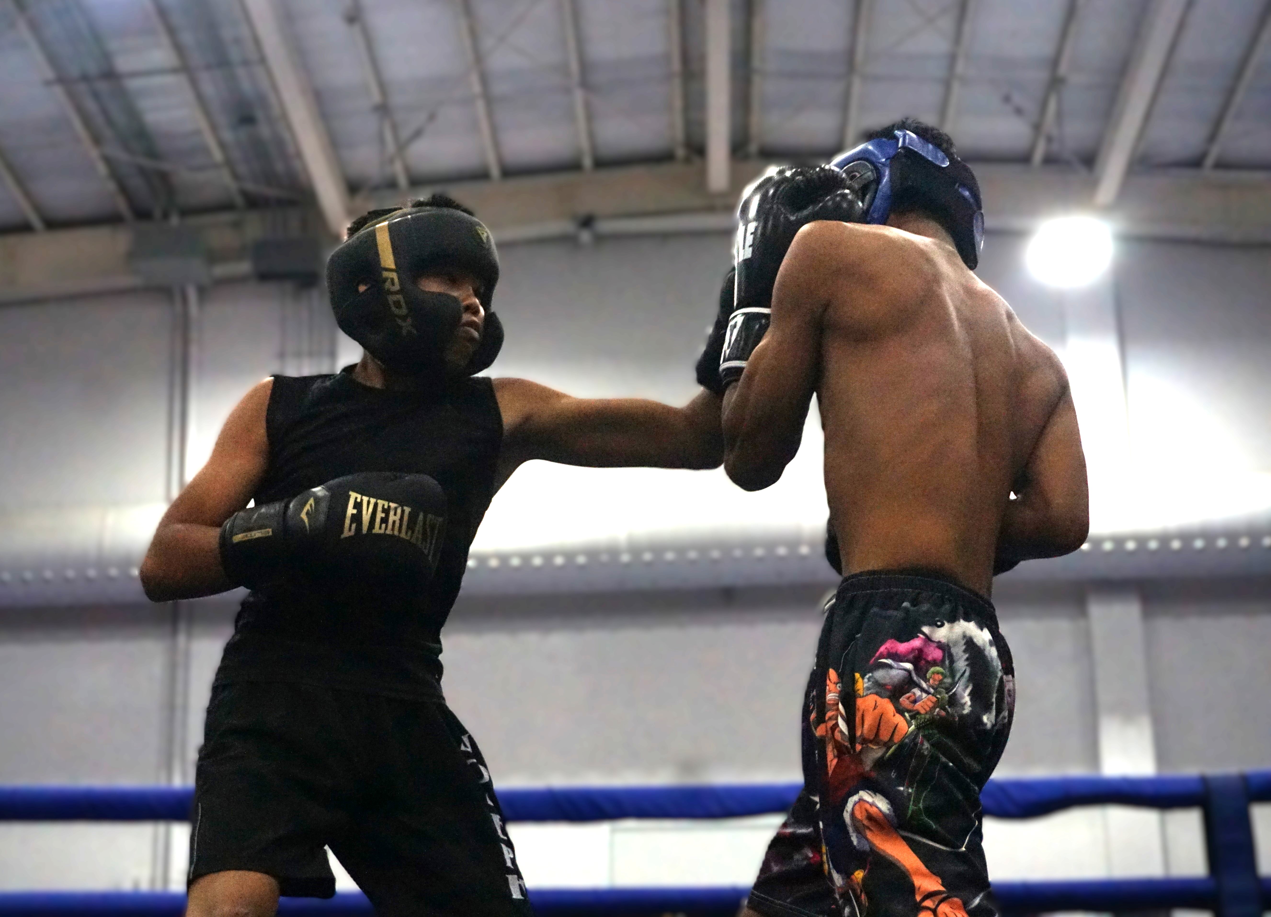 Joseph Saltin connects a jab against Guam's Jeran Tudela during an exhibition bout of the 1st Annual Box CNMI hosted by Al Cabael Production Company at the Gilbert C. Ada Gymnasium in Susupe on Saturday. 