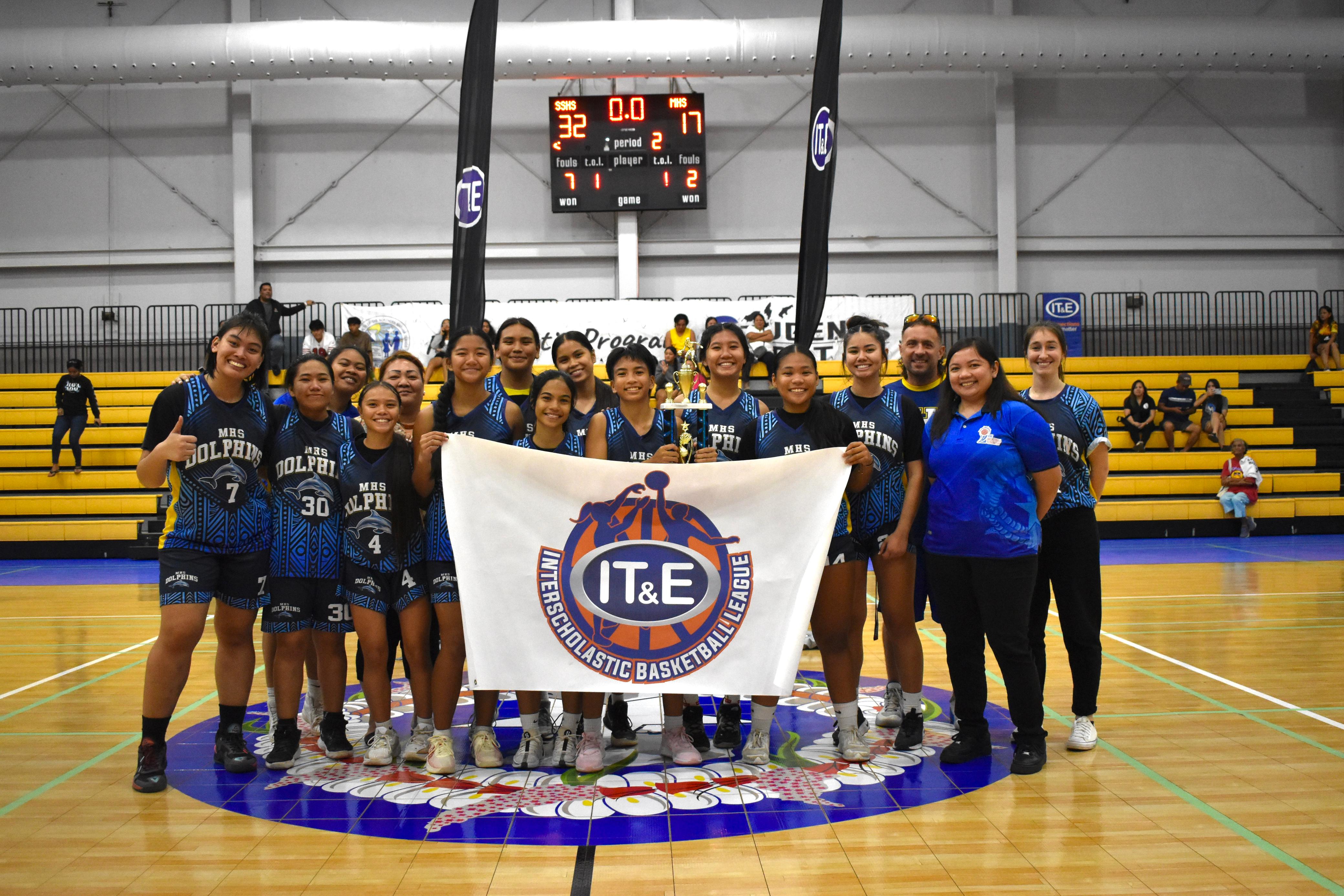 Marianas High School players pose with the second-place trophy in the girls highs school division of the PSS-NMIBF Interscholastic Basketball League SY24-25 at the Ada gym on Friday. 