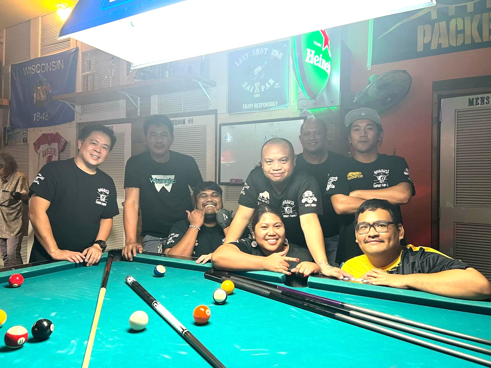 Last Shot Hobbies Chokie Chokie pose for a group photo after defeating the Last Shot Raiders in the Thursday division finals of the SBA Budweiser Open 8-Ball League 2024 at the Last Shot Bar on Thursday.