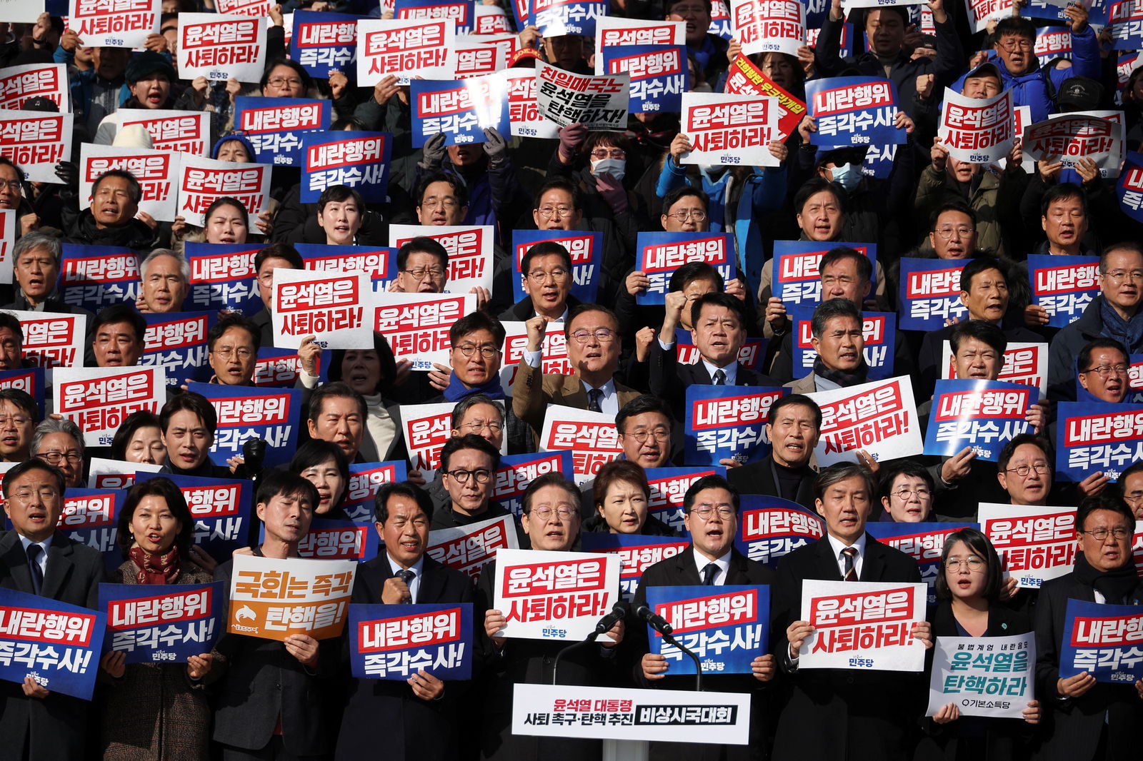 South Korea's main opposition Democratic Party leader Lee Jae-myung, lawmakers and other individuals attend a rally to condemn South Korean President’s surprise declarations of the martial law and to call for his resignation, at the National Assembly in Seoul, South Korea, Dec. 4, 2024.