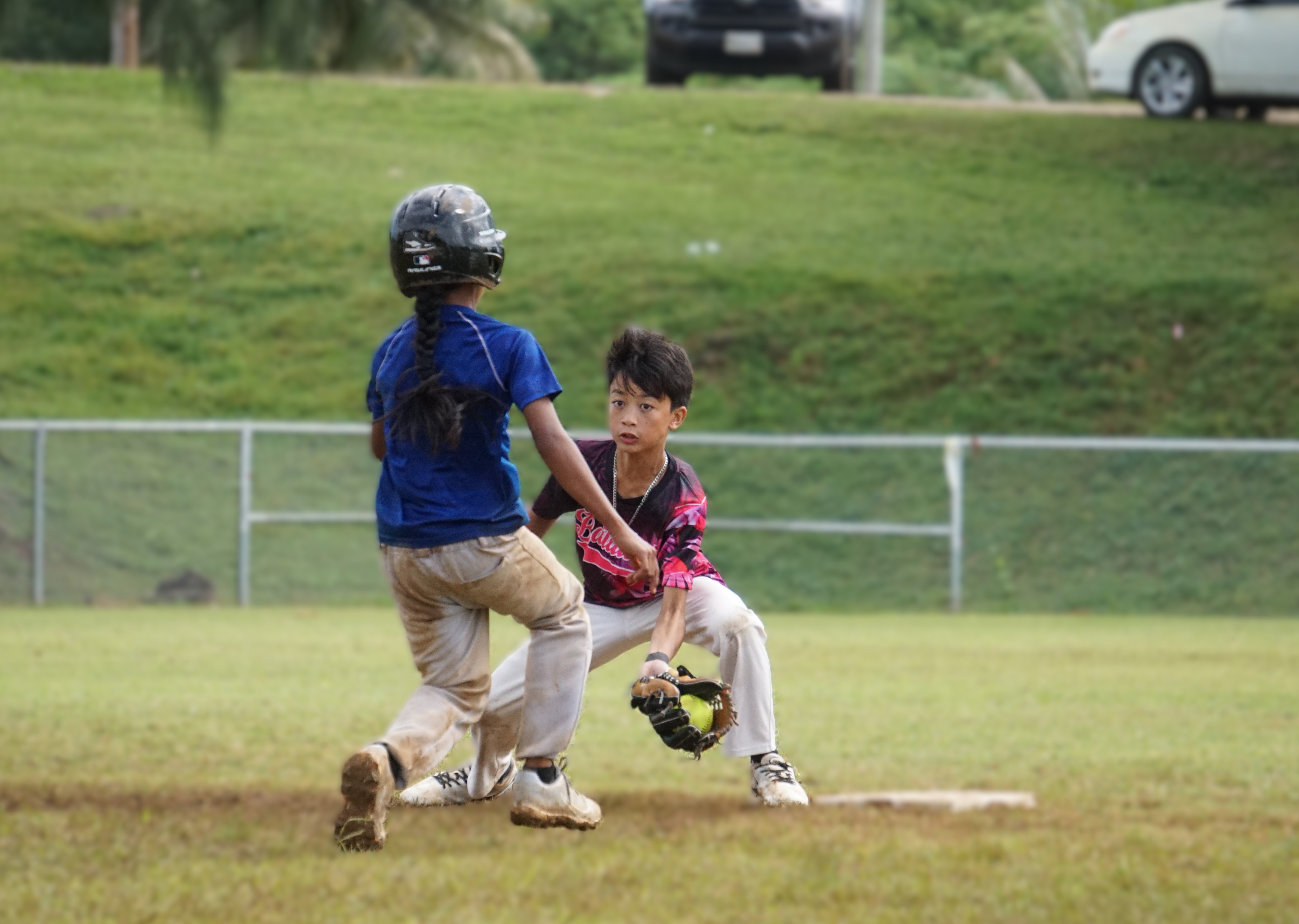 Tanapag Middle School second baseman Dayton Marchadesch beats a runner for the pickoff during the championship game against Hopwood Middle School in the boys middle school division of the PSS-NMISA Interscholastic Fastpitch Softball League SY24-25 at the Capital Hill softball field on Saturday.