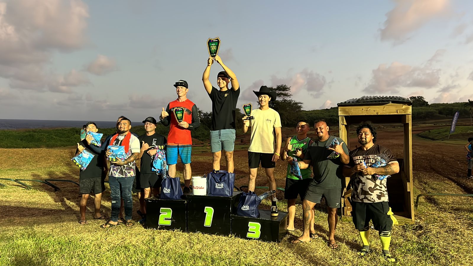 The top three finishers — Guam's James Cepeda, Tim Wenden, and Blaze Aiken — pose with their trophies alongside the other participants in the Open Expert Class during the awards ceremony of the Marianas Racing Association Turkey Cross 2024 at Cow Town Raceway Park over the weekend.