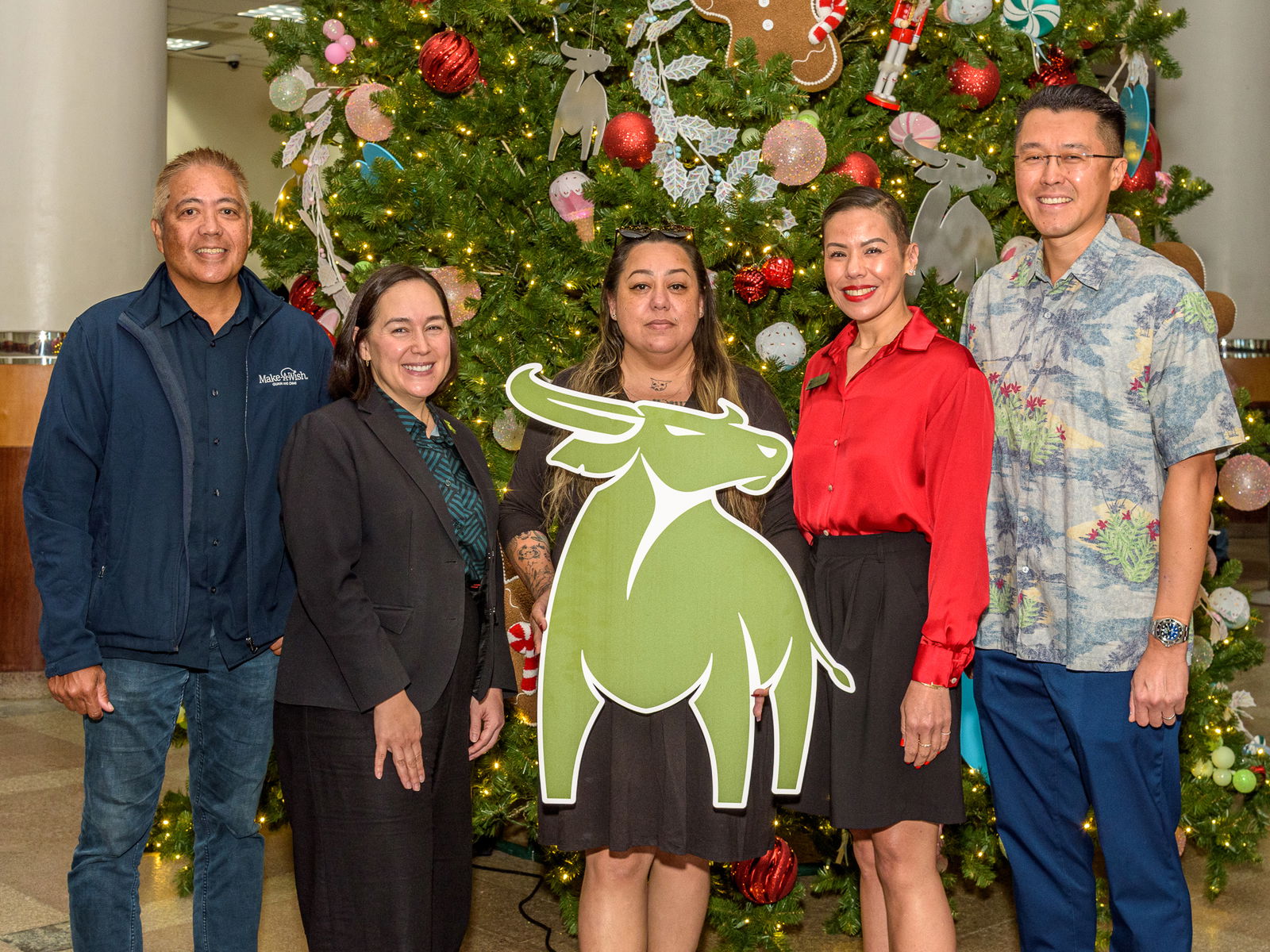 From left, Eric Tydingco, President/CEO, Make-A-Wish Guam and CNMI; Maria Eugenia Leon Guerrero, Executive Vice President, Chief Operating Officer, Bank of Guam; Tina Erickson, Office Manager, GAIN; Lesley-Anne Leon Guerrero, Senior Vice President, Chief Experience Officer, Bank of Guam; and Jason Miyashita, Board Chair, Make-A-Wish Guam and CNMI.