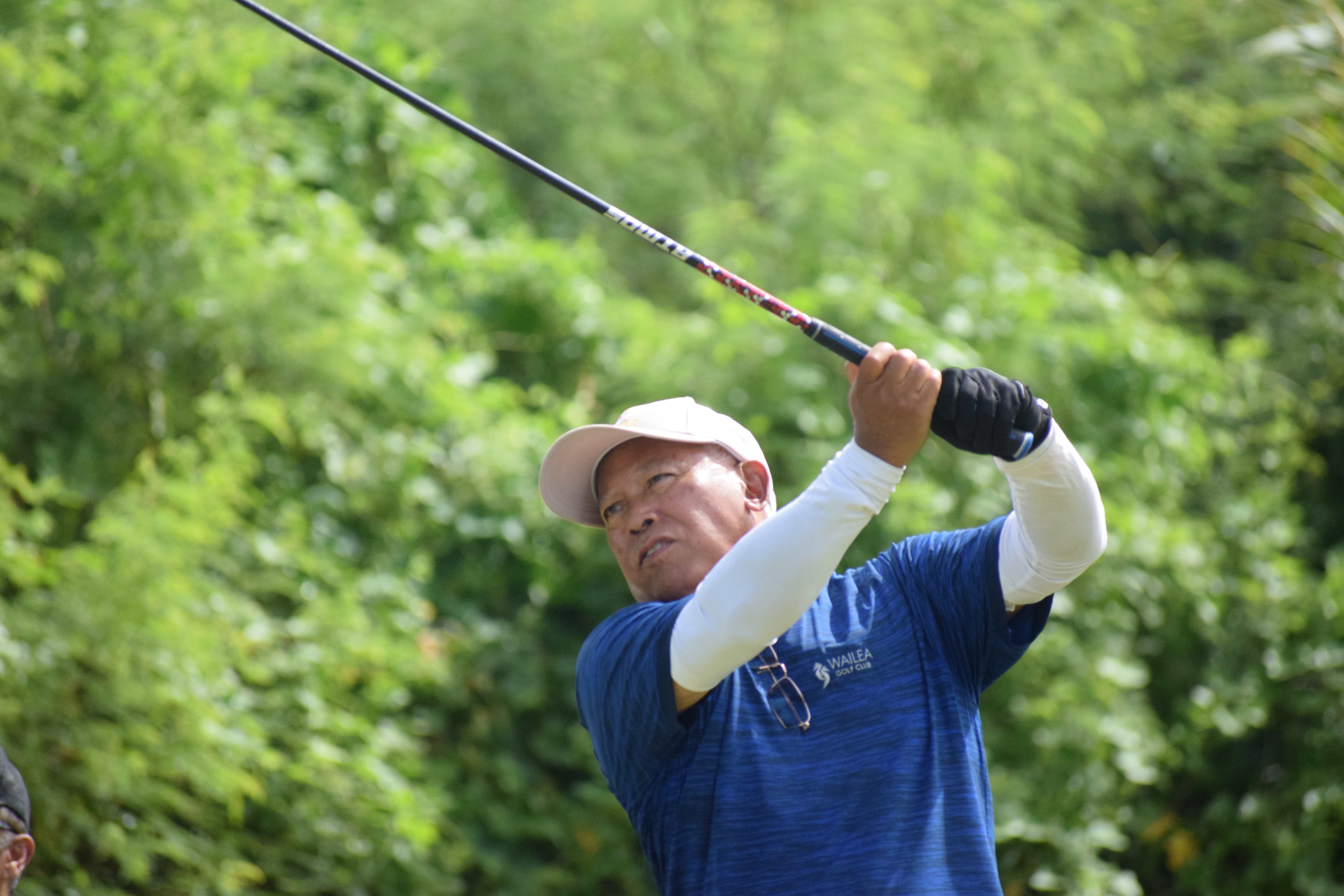 McDonald's of Guam and Saipan President Jose C. Ayuyu tees off for Hole No. 16.