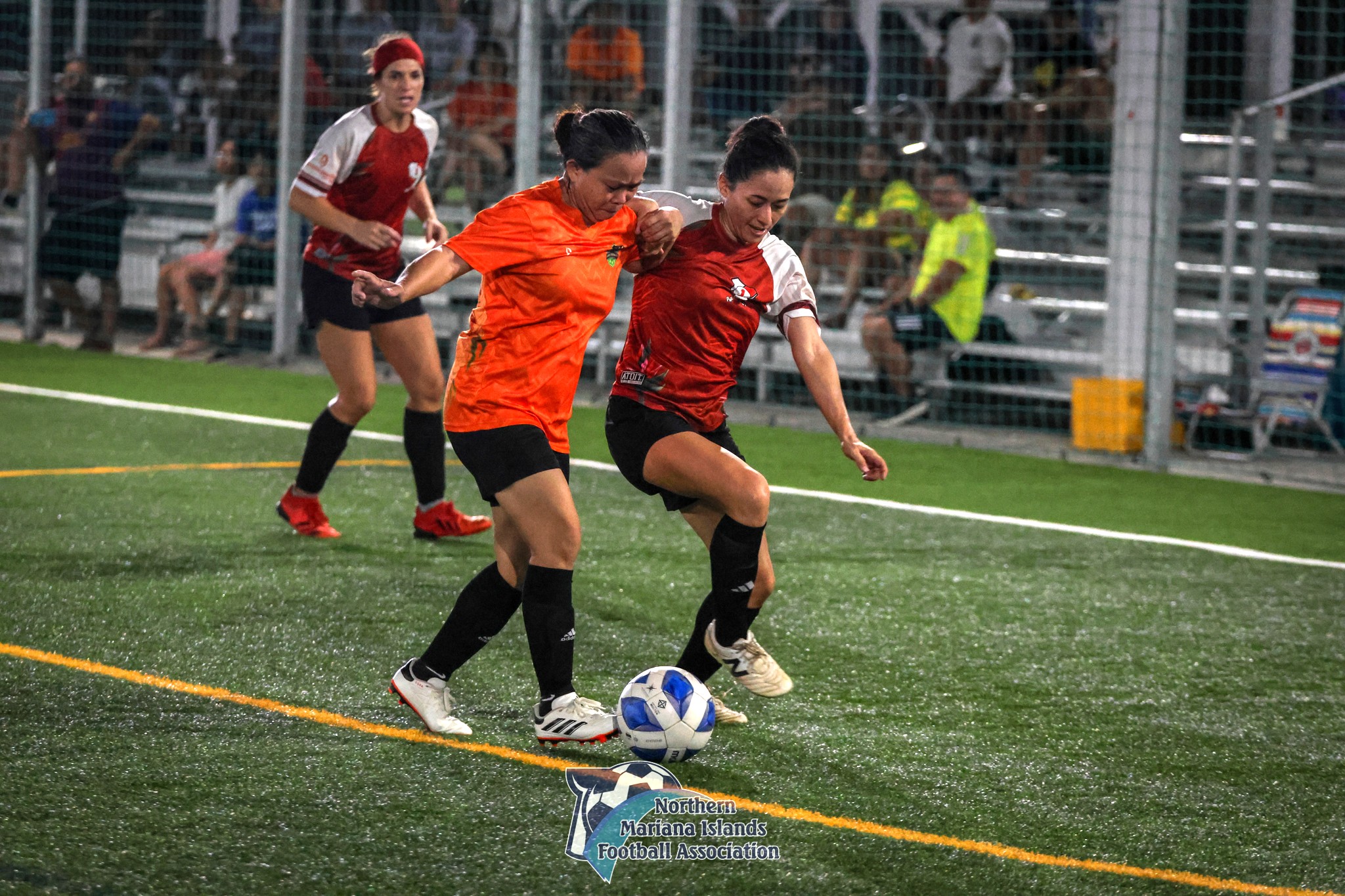 Paire's Natalie Hill-Beyer battles for the possession against Kanoa during the masters division title match of the Dove Women's League Fall 2024 at the NMI Soccer Training Center in Koblerville on Sunday.