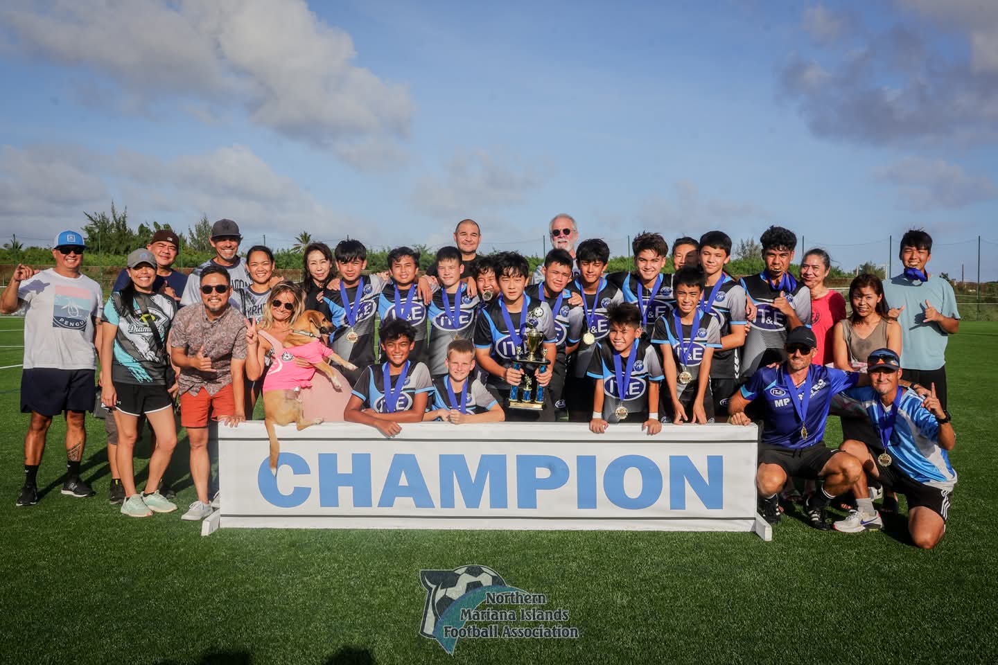 MP United Football Club players pose with the U14 boys division championship trophy of the TakeCare Youth Soccer League Fall 2024 after defeating Latte Football Club, 3-1, in the title match at the NMI Soccer Training Center on Saturday.