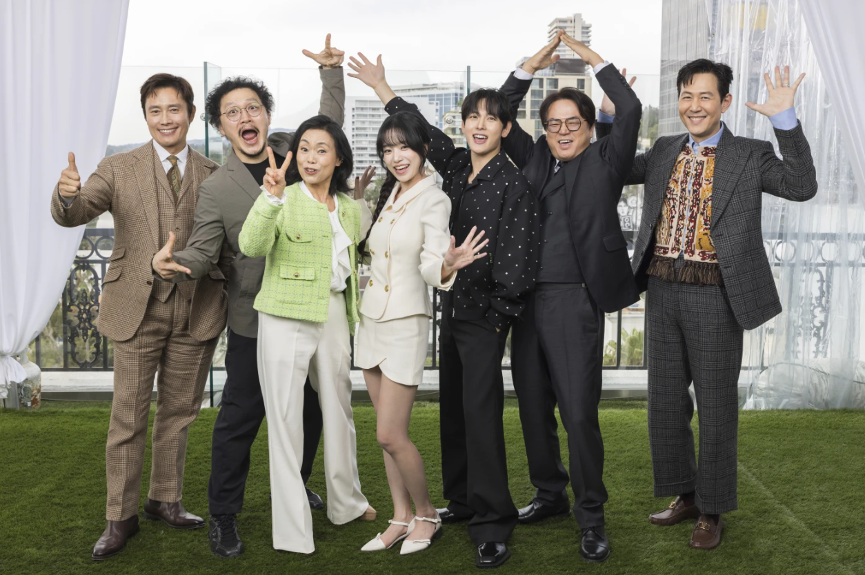 Lee Byung-hun, from left, Yang Dong-geun, Hwang Dong-hyuk, Jo Yu-ri, Im Si-wan, Kang Ae-Sim, Lee Seo-hwan and Lee Jung-jae post for a portrait to promote the second season of “Squid Game” on Dec. 11, 2024 in Los Angeles.