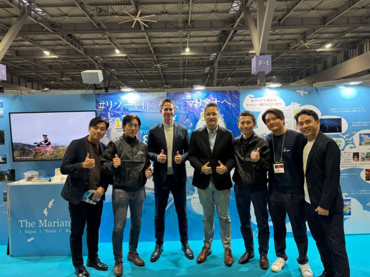 Executive Officer Toshiyuki Azeo of Toyota Tsusho, second left; General Manager and Vice President Clark Boswell of AK Guam and Saipan, third left; Marianas Visitors Authority Managing Director Christopher A. Concepcion, center; General Manager Masanori Shibata of Toyota Tsusho Corp., third right; President Yugo Narita of Aqua Connections; and other executives of Toyota Tsusho and MVA at The Marianas promotional booth at the Toyota Group Thanks Sale on Dec. 7 & 8, 2024, in Nagoya, Japan. The trade show attracted an estimated 15,000 attendees.