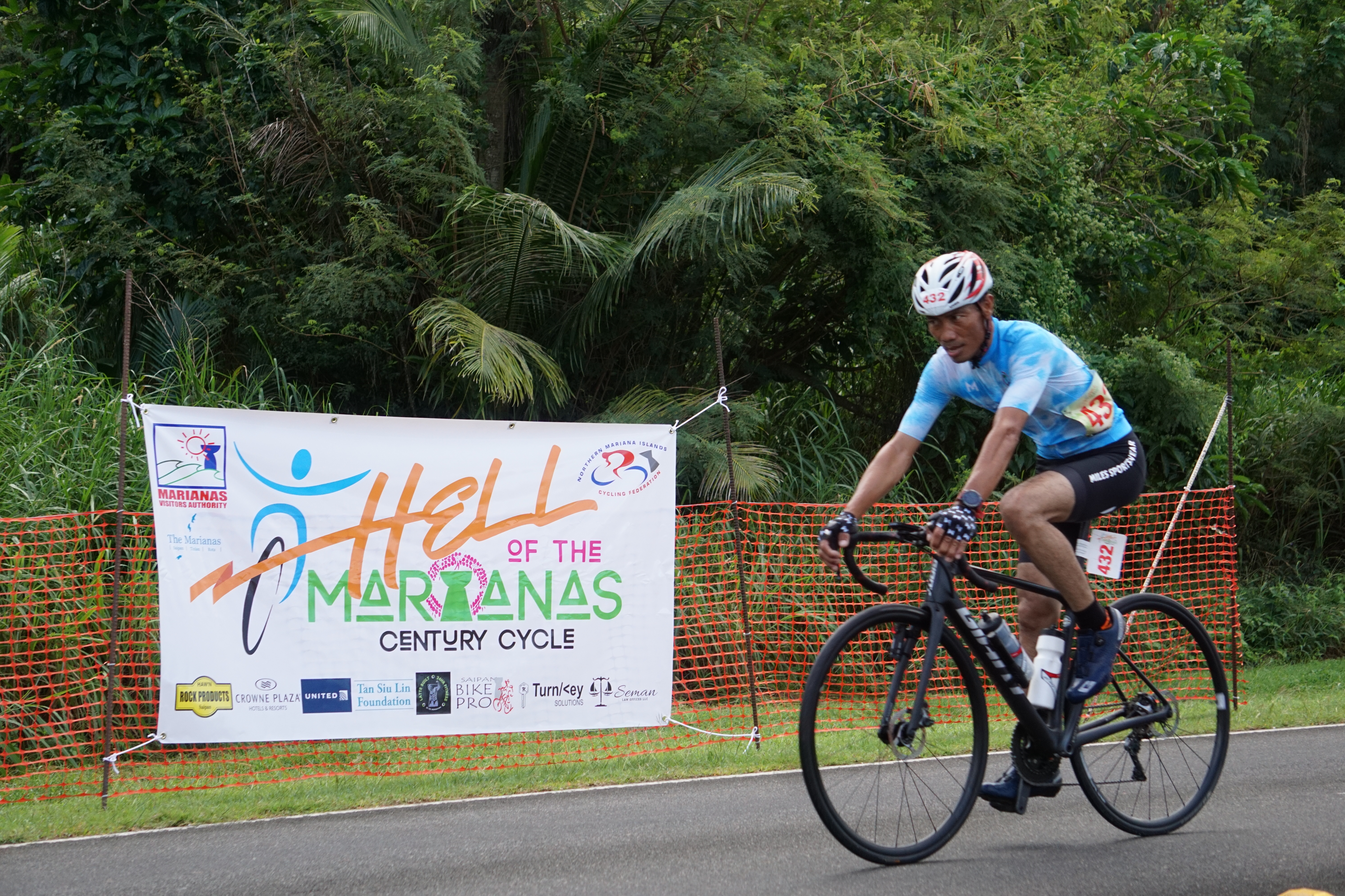 Hernando Cristobal closes in on the finish line to win first place in the road bike short course (50K) category of the 2024 Hell of the Marianas at the former Mariana Resort & Spa on Saturday morning.