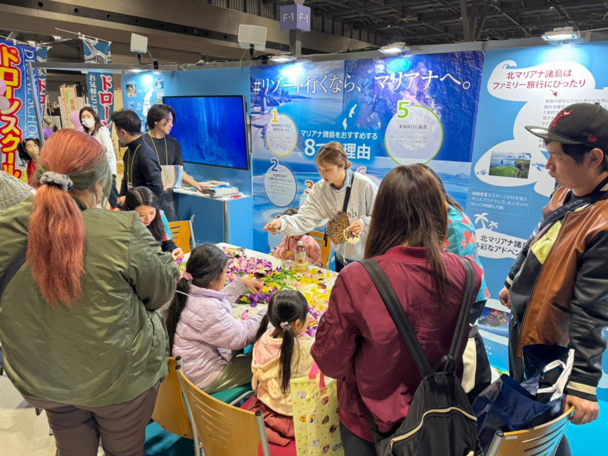 Attendees of the Toyota Group Thanks Sale on Dec. 7 & 8, 2024, in Nagoya, Japan, learn Carolinian “mwar”-making (floral head lei) at The Marianas booth. The Marianas Visitors Authority, Toyota Tsusho, Toyota Tourist and AK Toyota promote attractions in The Marianas at the trade show.