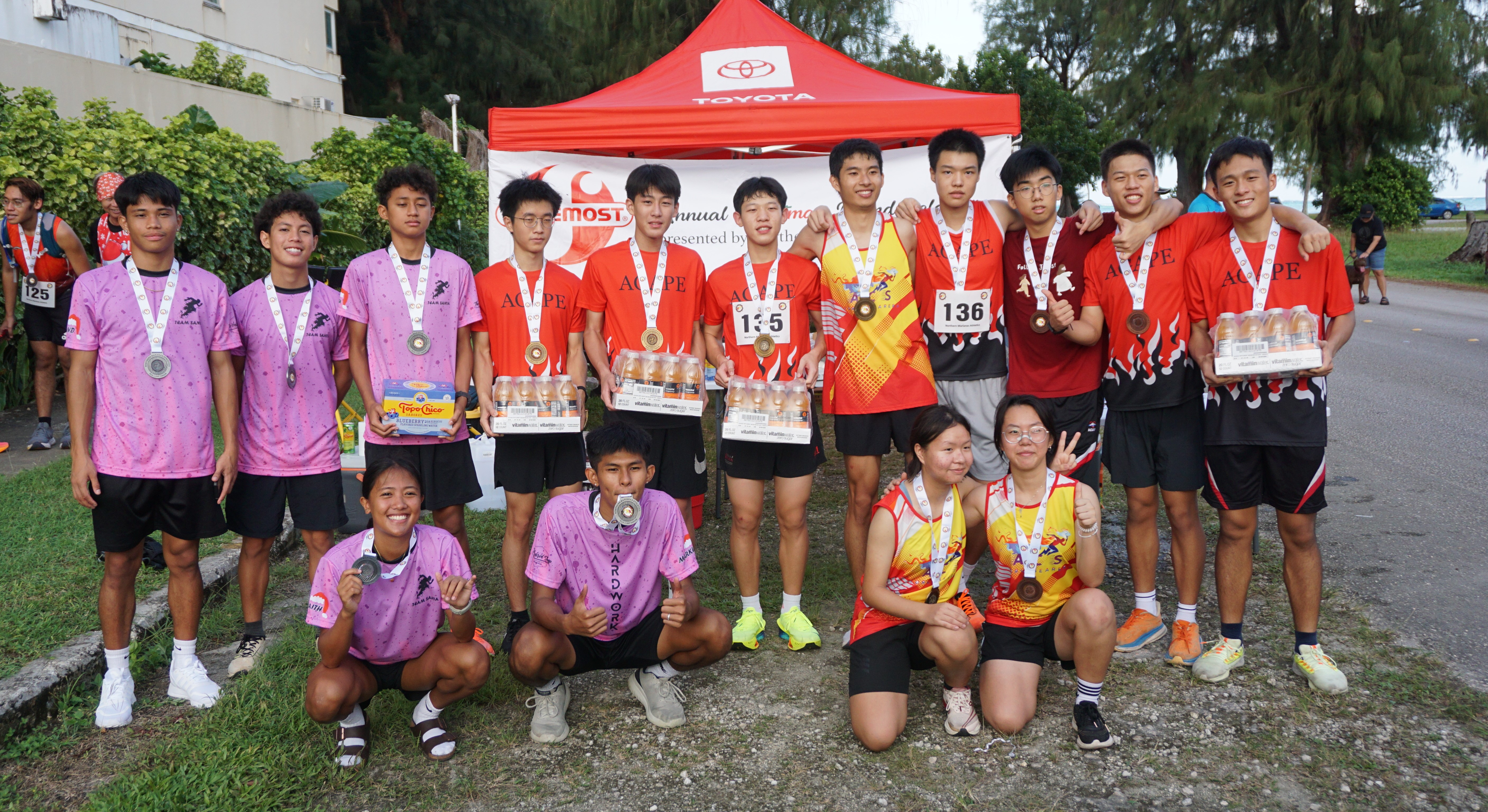 The top three teams — Agape Team 1, Team Santa 2024, and Agape Team 2 — pose for a group photo.