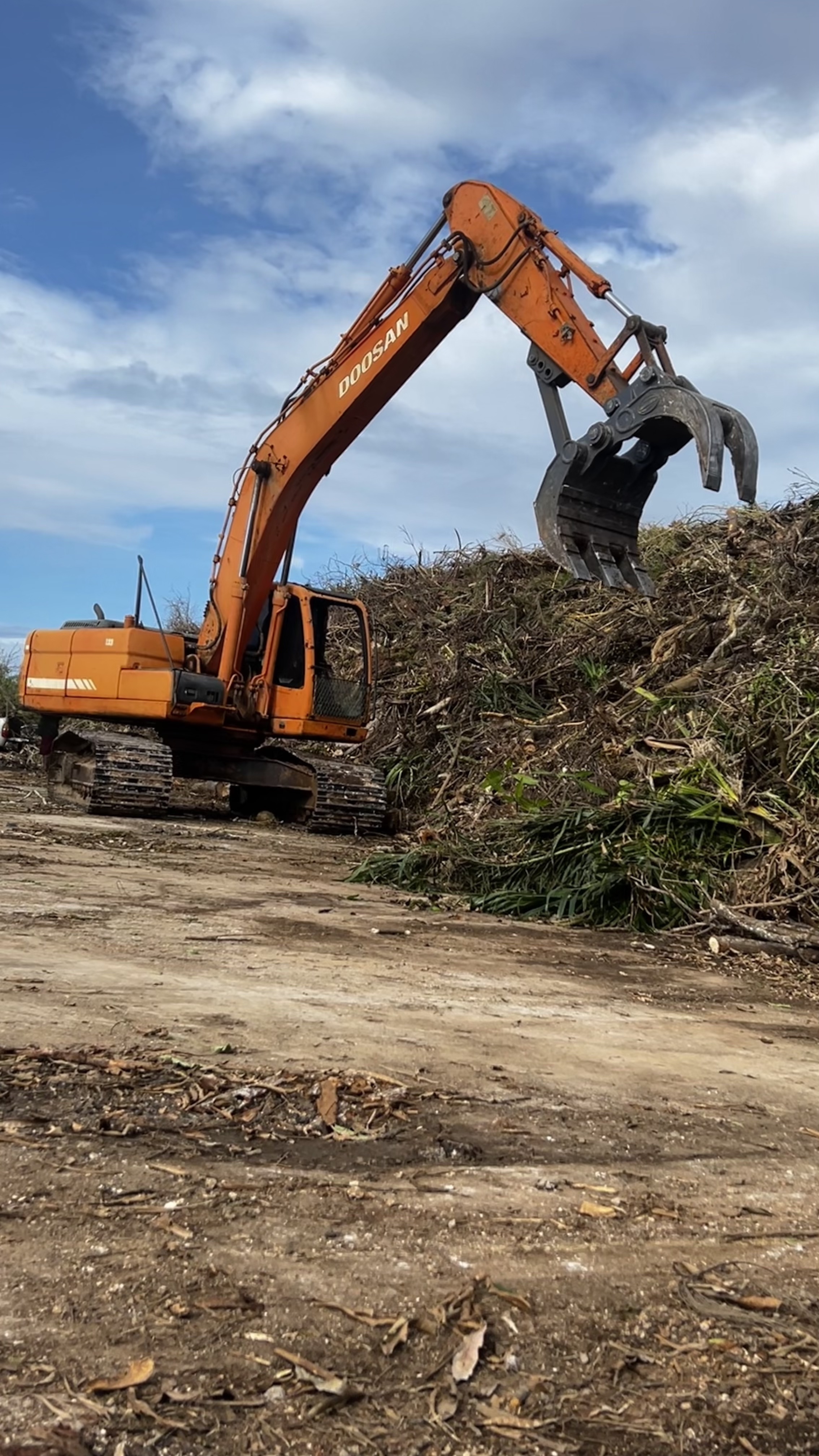 Heavy machinery manages record-breaking volumes of green waste in Guam.