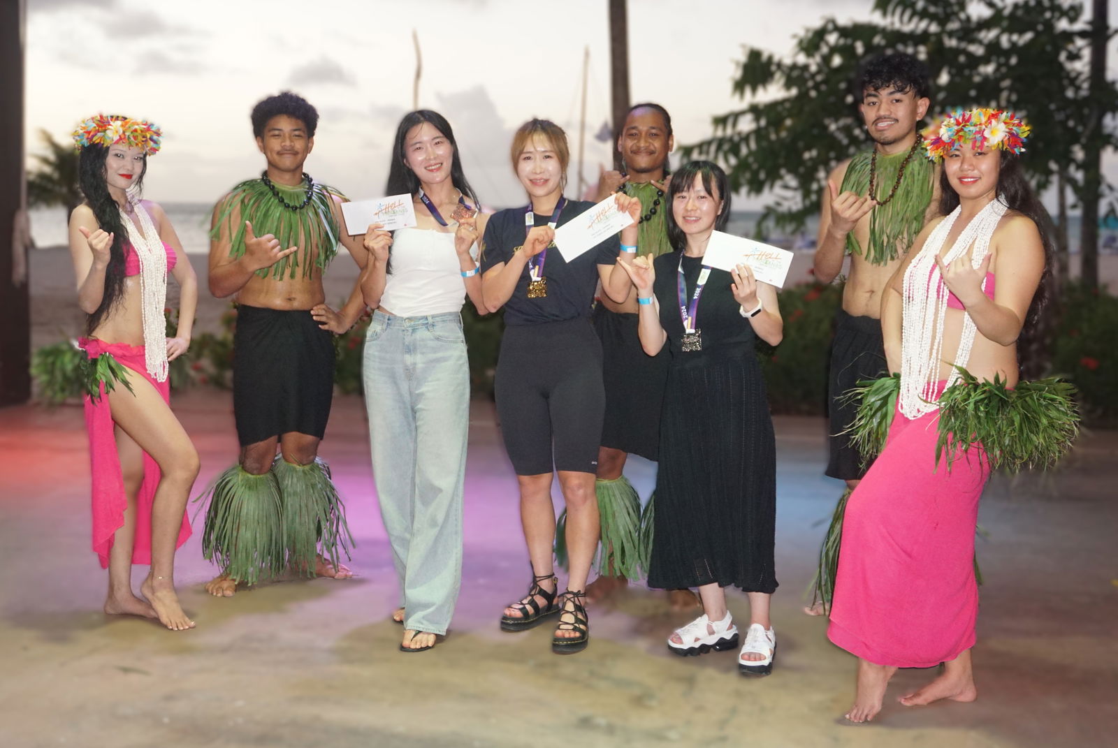 The women’s pro/elite top three finishers, Jiseon Jang, Miso Kim, and Yukako Suzuki pose with their cash prizes during the awards banquet of the 2024 Hell of Marianas at the Ataari Restaurant of Crowne Plaza Resort Saipan on Saturday.