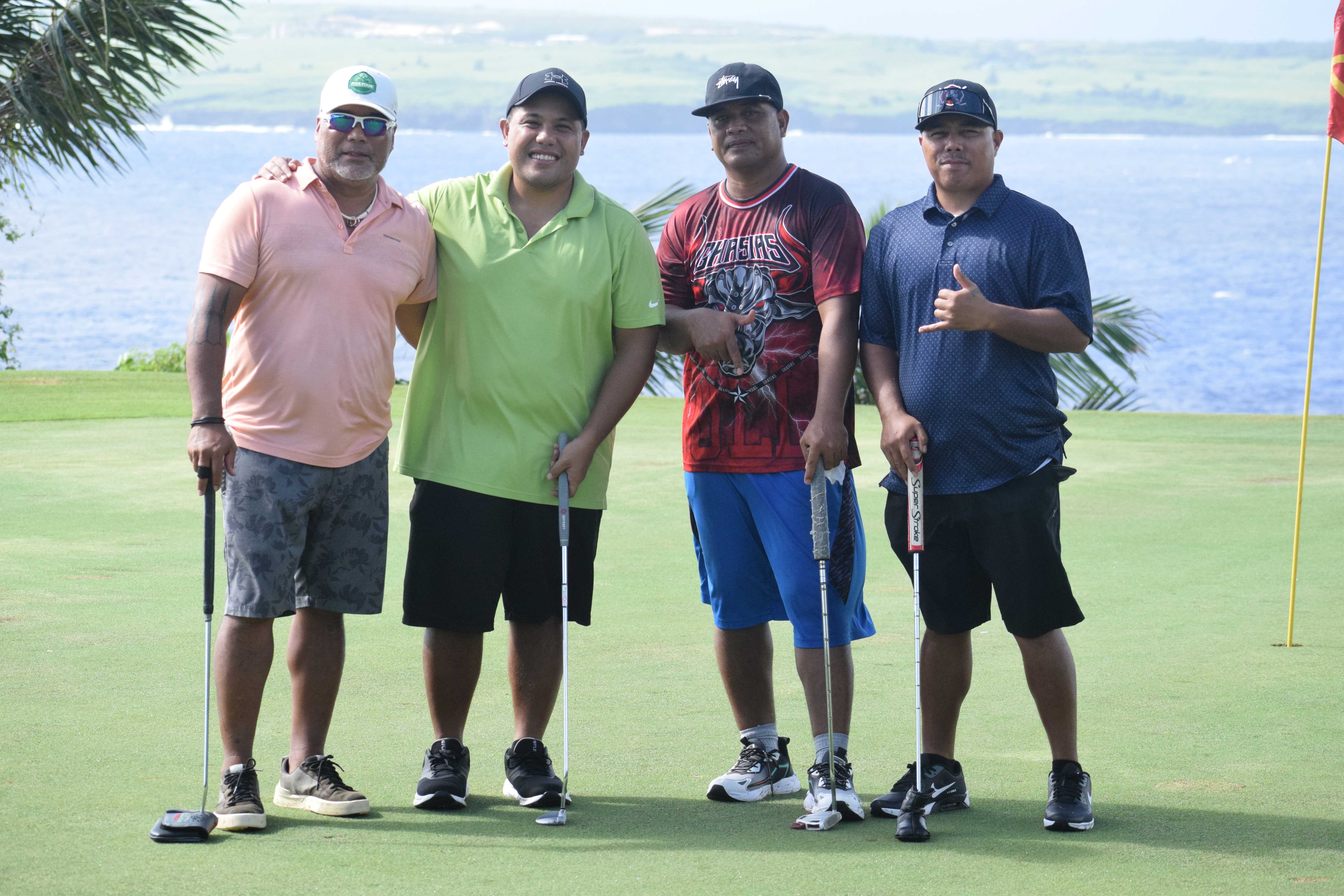 Rev. Fr. James S. Balajadia, second left, and former Rep. Marco Peter pose with two other local golfers.