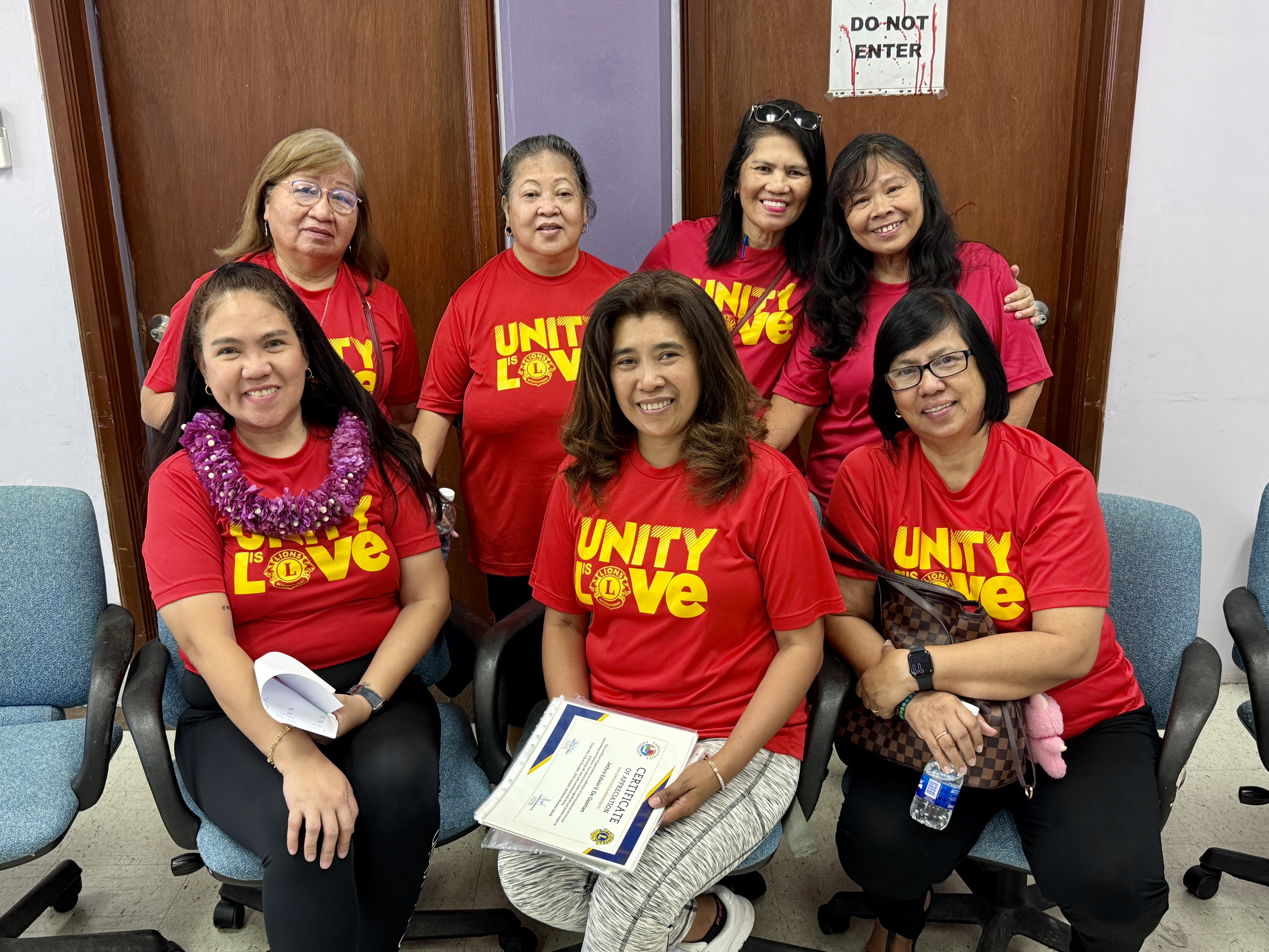 Saipan Unity Lions Club members pose for a photo at the manamko’ center.
