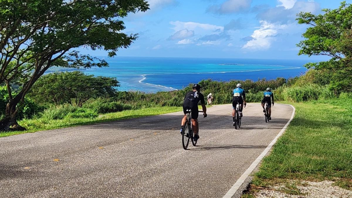 Cyclists descend from the peak of Suicide Cliff during Hell of the Marianas on Dec. 7, 2024, in Saipan.