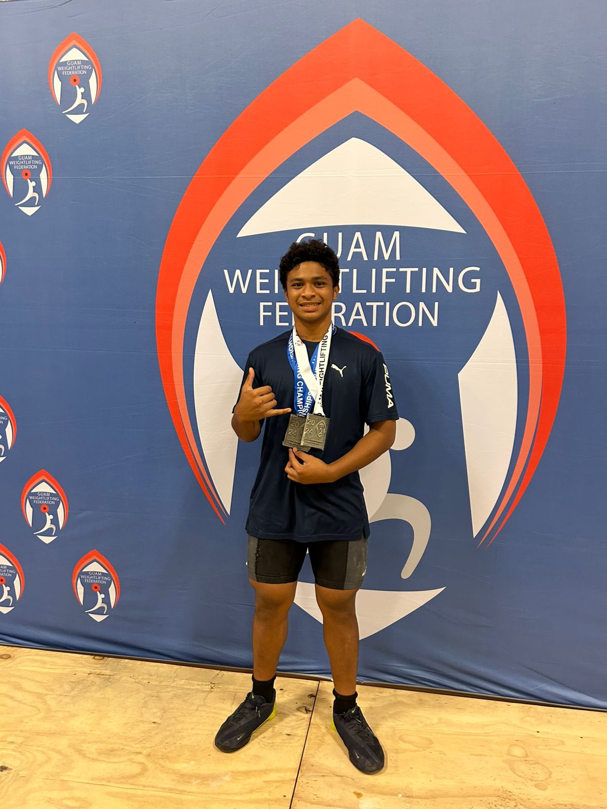 GetFit CNMI's Aiden Gimed poses with the medals he won at the 2024 Guam Weightlifting Federation Youth, Junior & Senior Championships at the Guam National Guard Readiness Center on Saturday. 