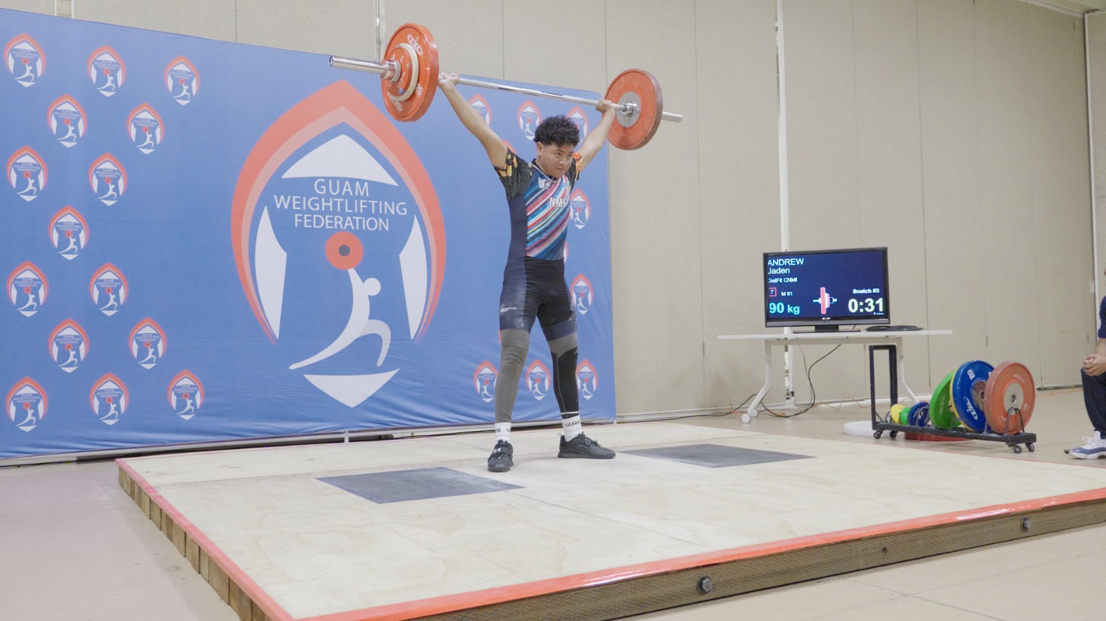 GetFit CNMI's Jaden Andrew scores a snatch lift during the 2024 Guam Weightlifting Federation Youth, Junior & Senior Championships at the Guam National Guard Readiness Center on Saturday.