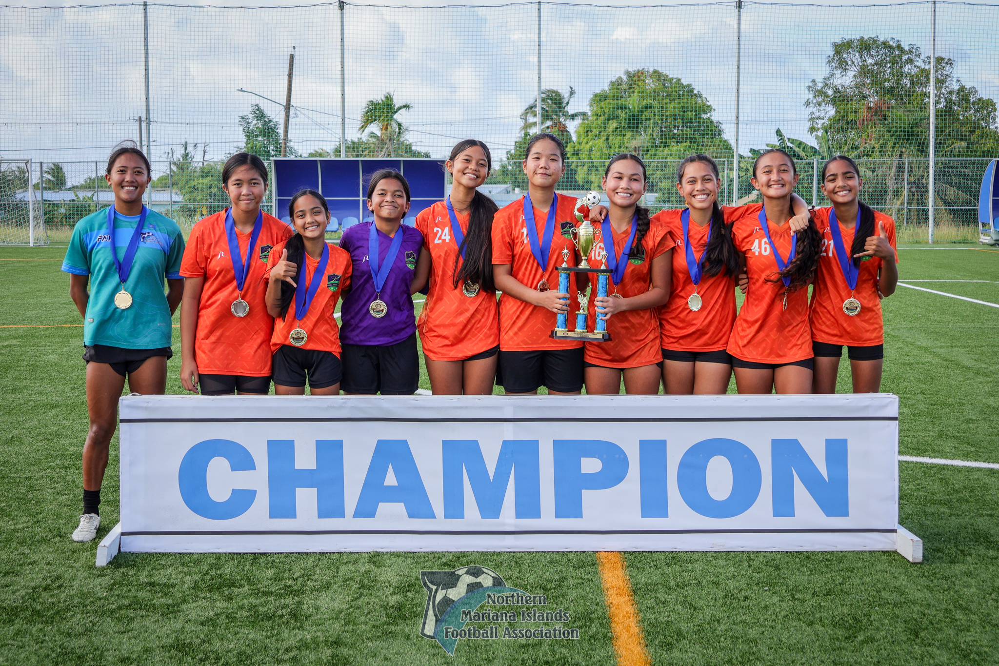 Kanoa Football Club players pose with the U14 girls division championship trophy of the TakeCare Youth Soccer League Fall 2024 after defeating Latte Football Club, 3-1, in the finals at the NMI Soccer Training Center on Saturday.