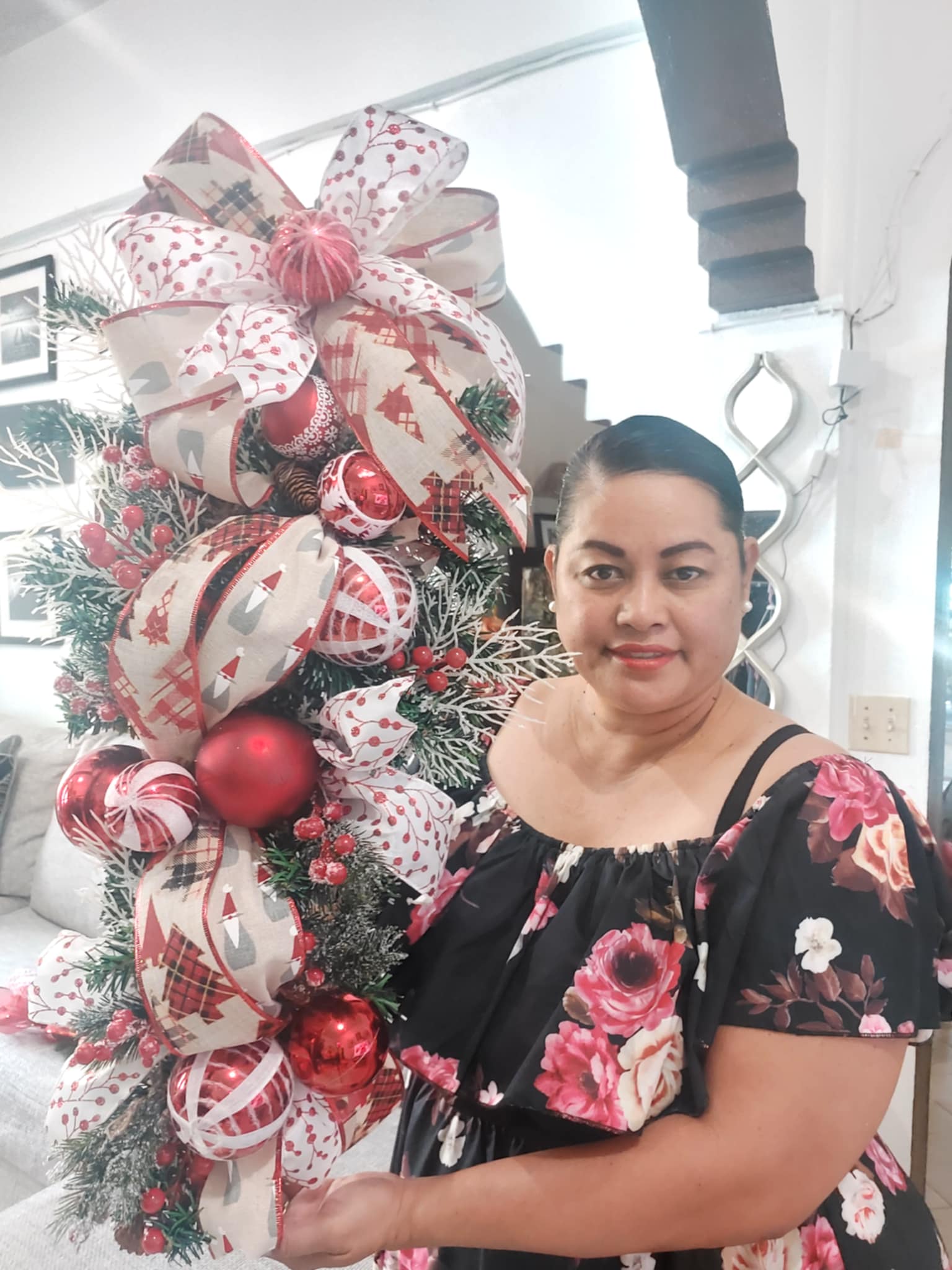 Designer Wreath & Co.'s Arlene Reyes shows off one of her bespoke wreaths.