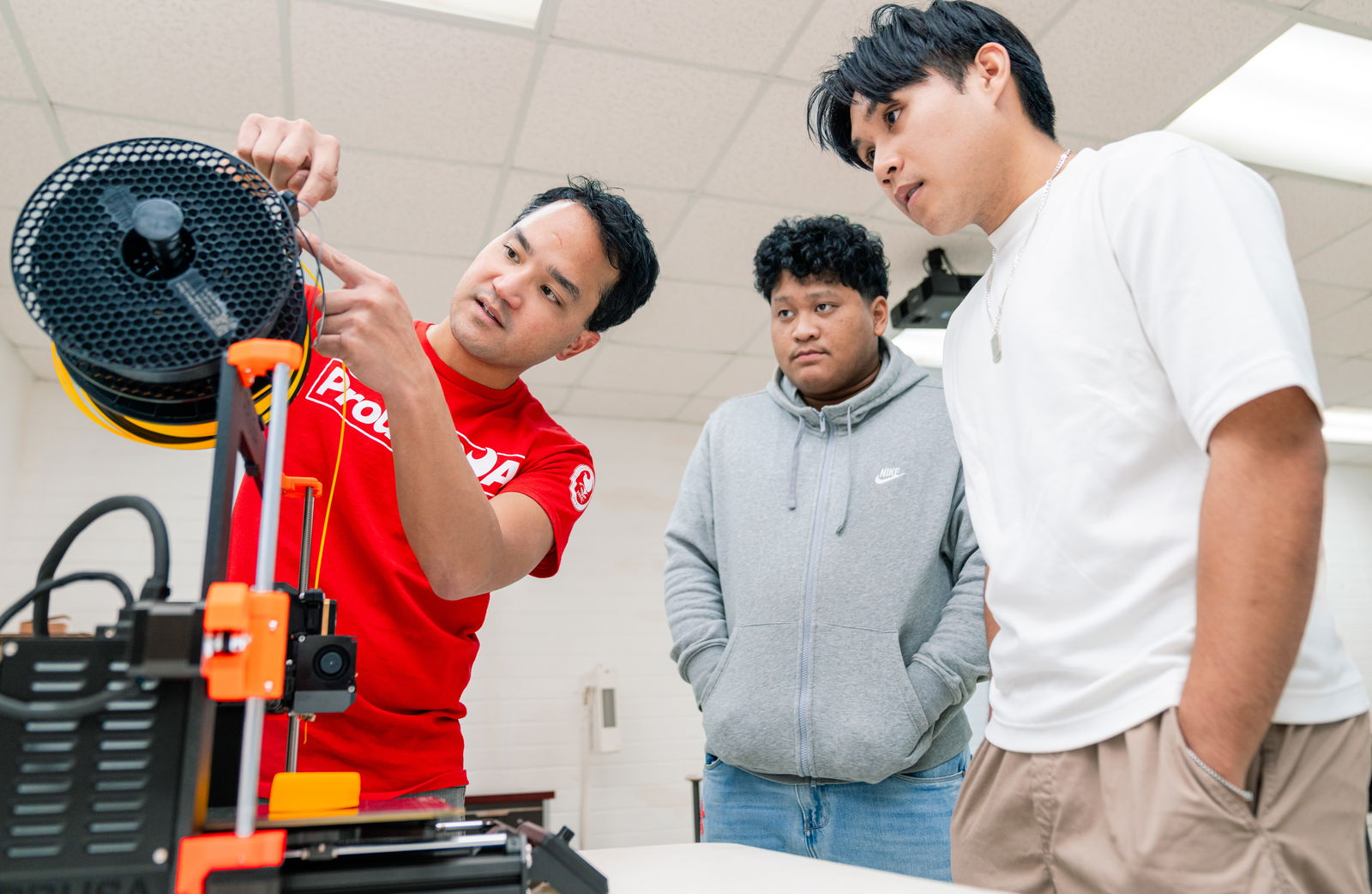 Emmanuel Borja, left, Northern Marianas College adjunct instructor, shows students how 3D printers can be deployed to aid in design work while also helping them to build their technical and practical skills in computer-aided design or CAD tools and 3D printing technology. The course is part of NMC’s pre-engineering program, which is part of the college’s broader initiative to equip students with the skills and experience needed for future careers in STEM fields.NMC photo
