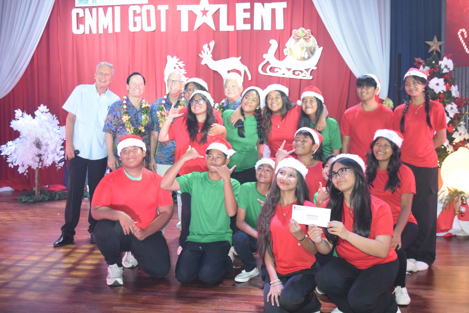 The Hopwood Middle School Glee Club members, the children’s category champions, pose with Gov. Arnold I. Palacios, Bridge Capital LLC co-owners John Baldwin and Shawn Scott, and host Brad A. Cleven.