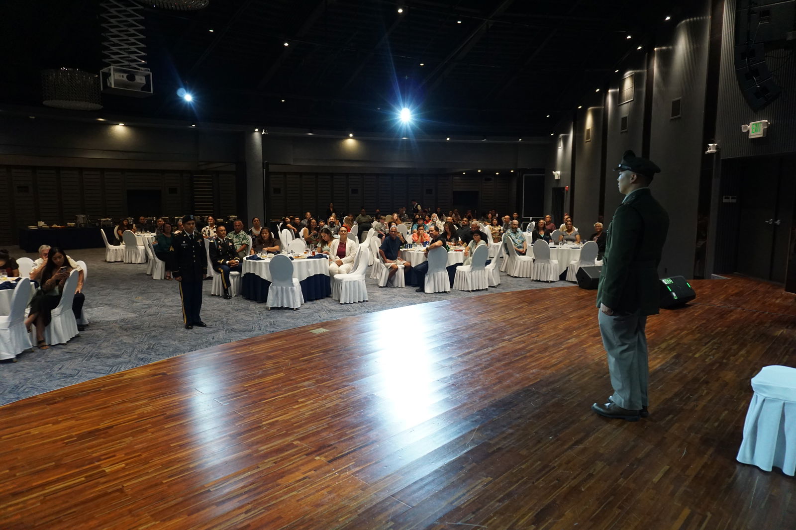 Sgt. Joshua Roberto, left, is ready to give Franklin Babauta Jr. his first solute as an officer.