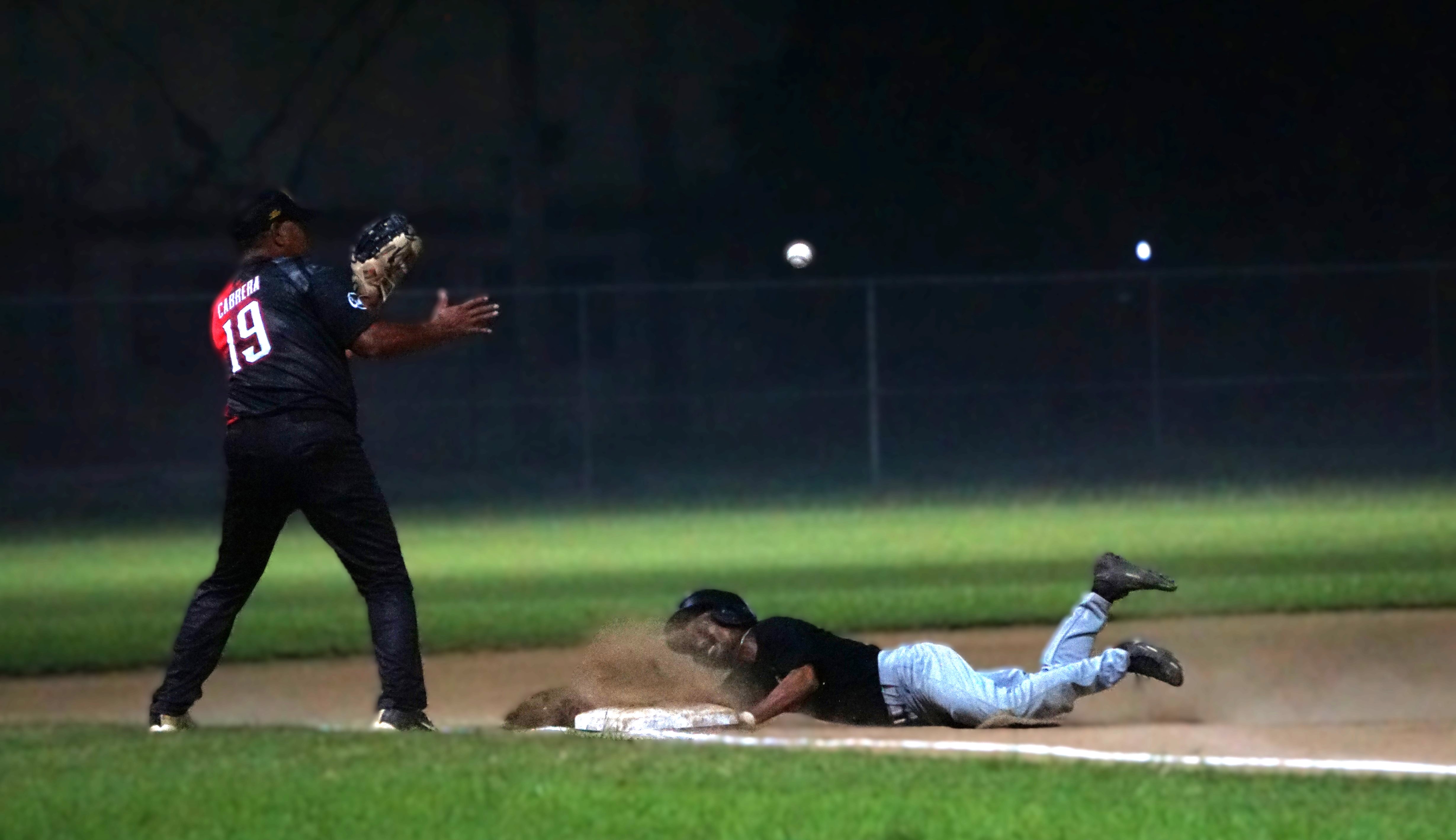 The Blue Jays’ Shawn Matsutaro slides to steal third base beating the pickoff against the Falcons during a game in the 2024 SBL Masters League at the Francisco “Tan Ko” Palacios Baseball Field on Tuesday night. 