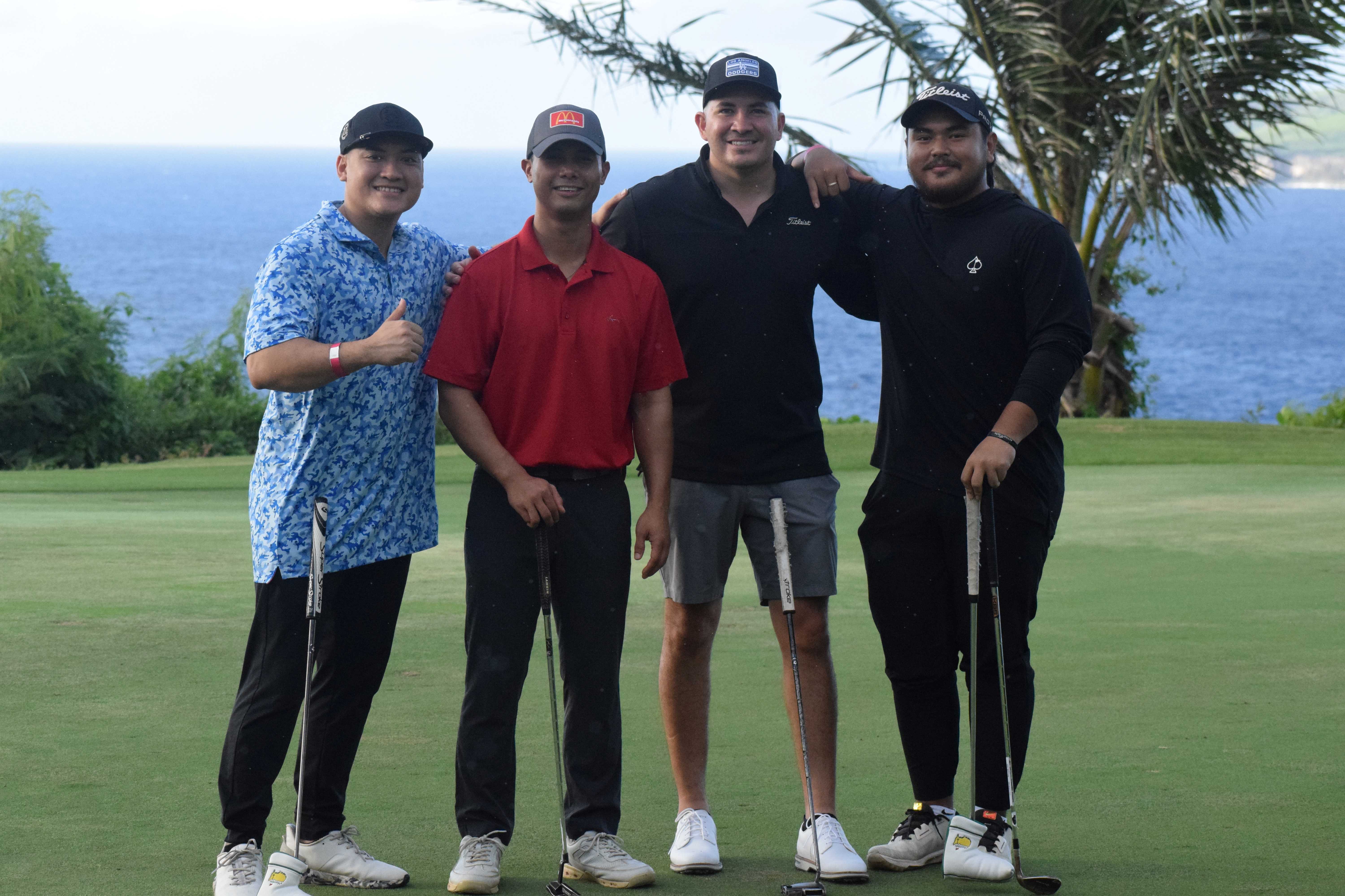 McDonald's of Guam and Saipan Vice President Joe Ayuyu Jr., second left, joins visiting golfers from Guam.