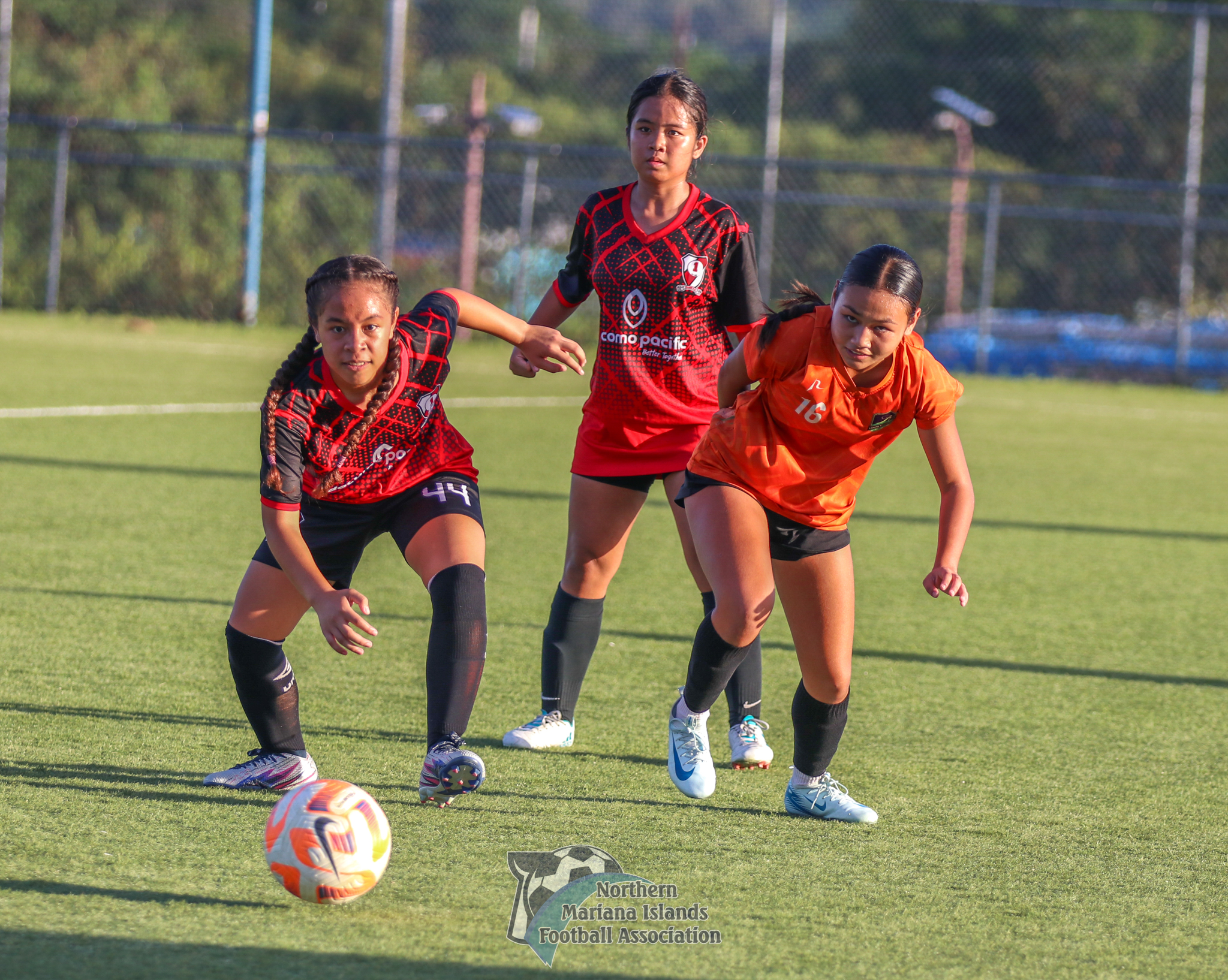 Kanoa FC's Aubrey White and a PFC player race to claim the possession during a game in the A Division of the Dove Women's League Fall 2024 at the NMI Soccer Training Center in Koblerville.