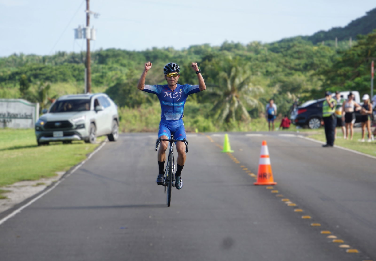 Dr. Ryo Inoue celebrates as he approaches the finish line of the 2024 Hell of the Marianas at the former Mariana Resort & Spa on Saturday morning. 