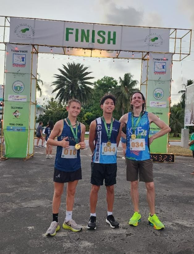 Top finishers in the 5K course of the 2nd Annual Rota Marathon on Jan. 18, 2025 with their medals at the finish line. From left, 2nd place Eldon Egbert, 1st place Victor Nash Santos, and 3rd place Michael Owen.