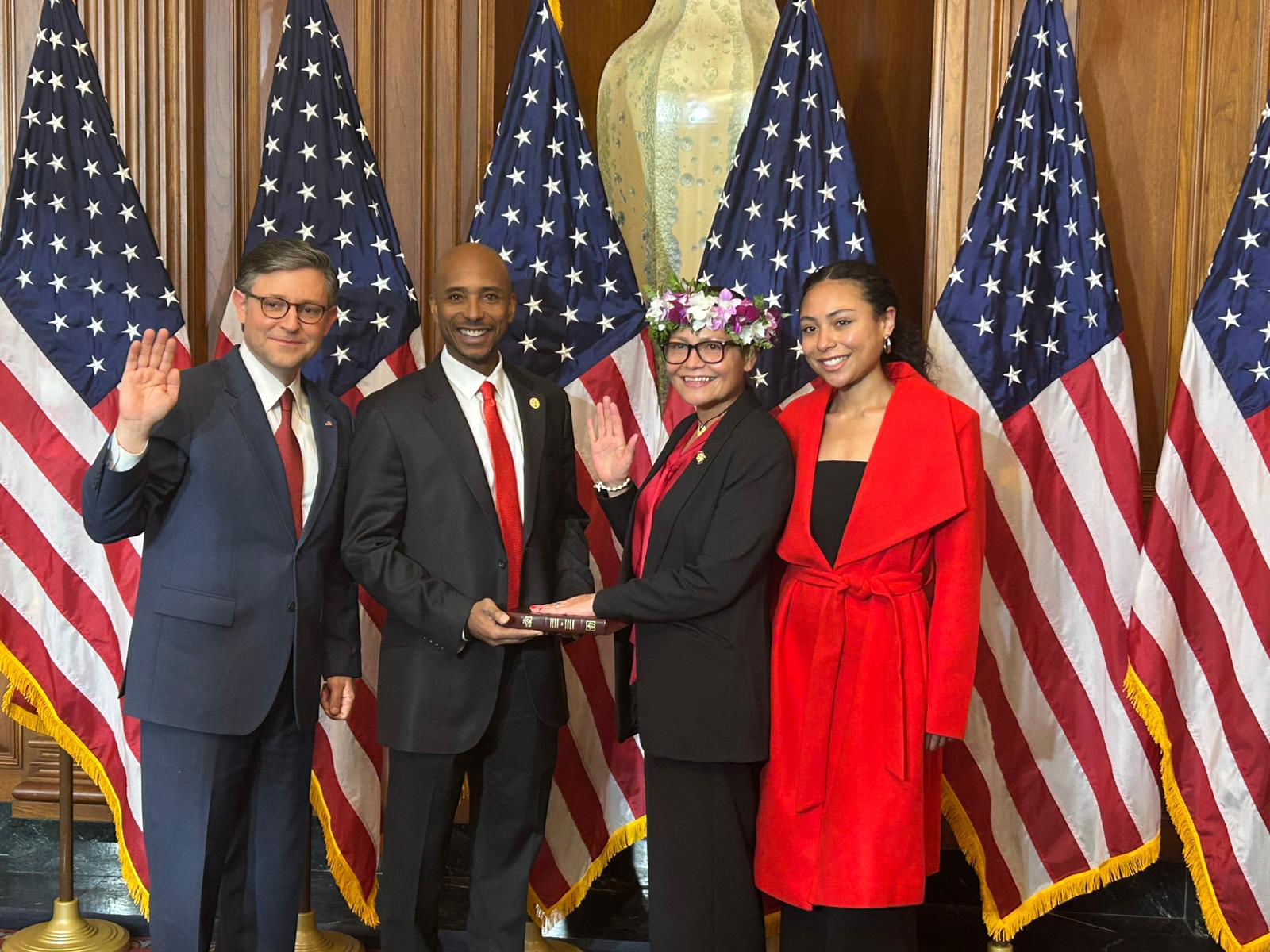 U.S. Congresswoman Kimberlyn King-Hinds during the ceremonial swearing in ceremony with Speaker of the House Mike Johnson, her husband Chester Hinds and daughter Sydney.
