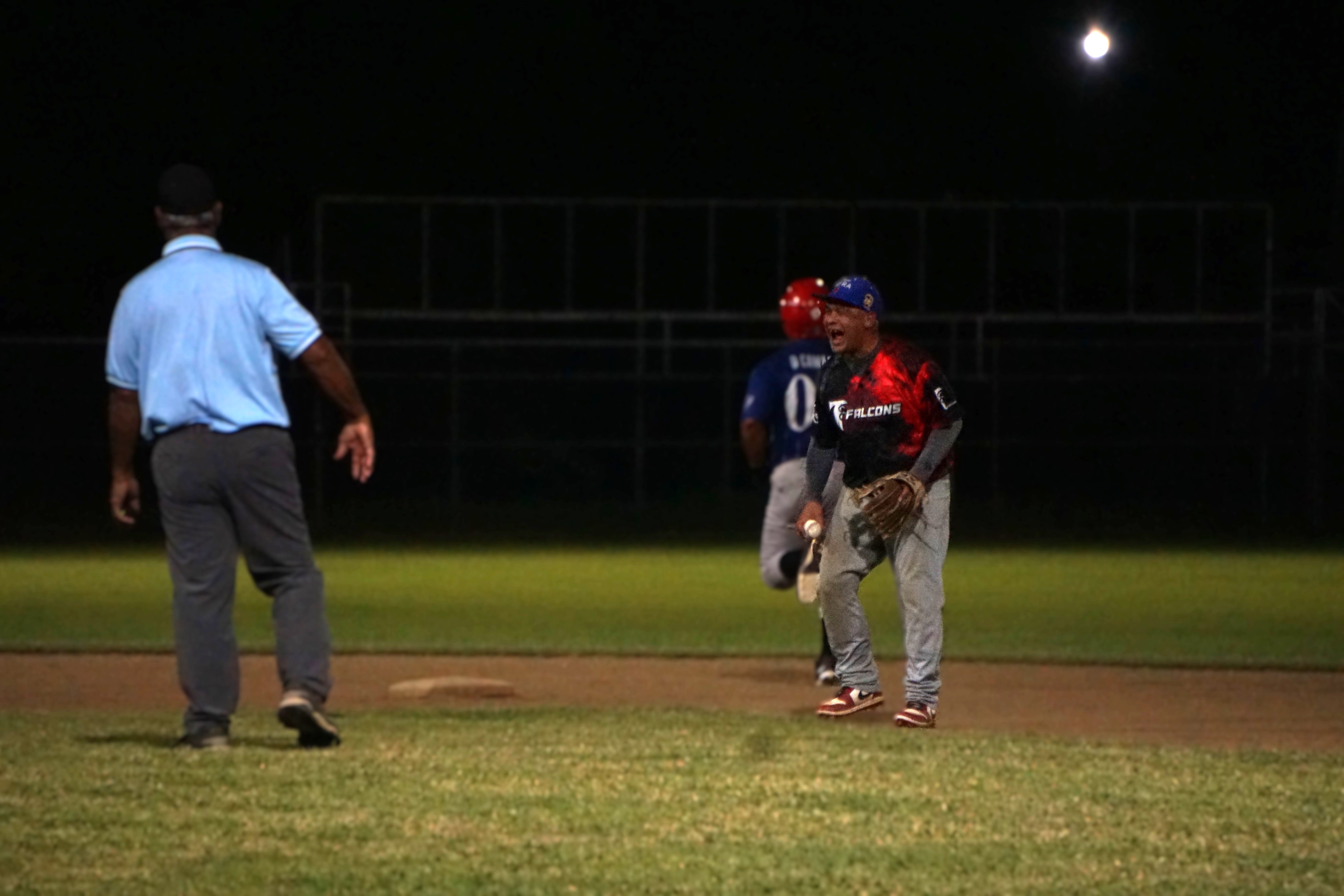 The Falcons’ shortstop, Jess Pua, celebrates after picking off a runner at second base during a game against the Brewers in the 2024 SBL Masters League at the Francisco “Tan Ko” Palacios Baseball Field on Monday.