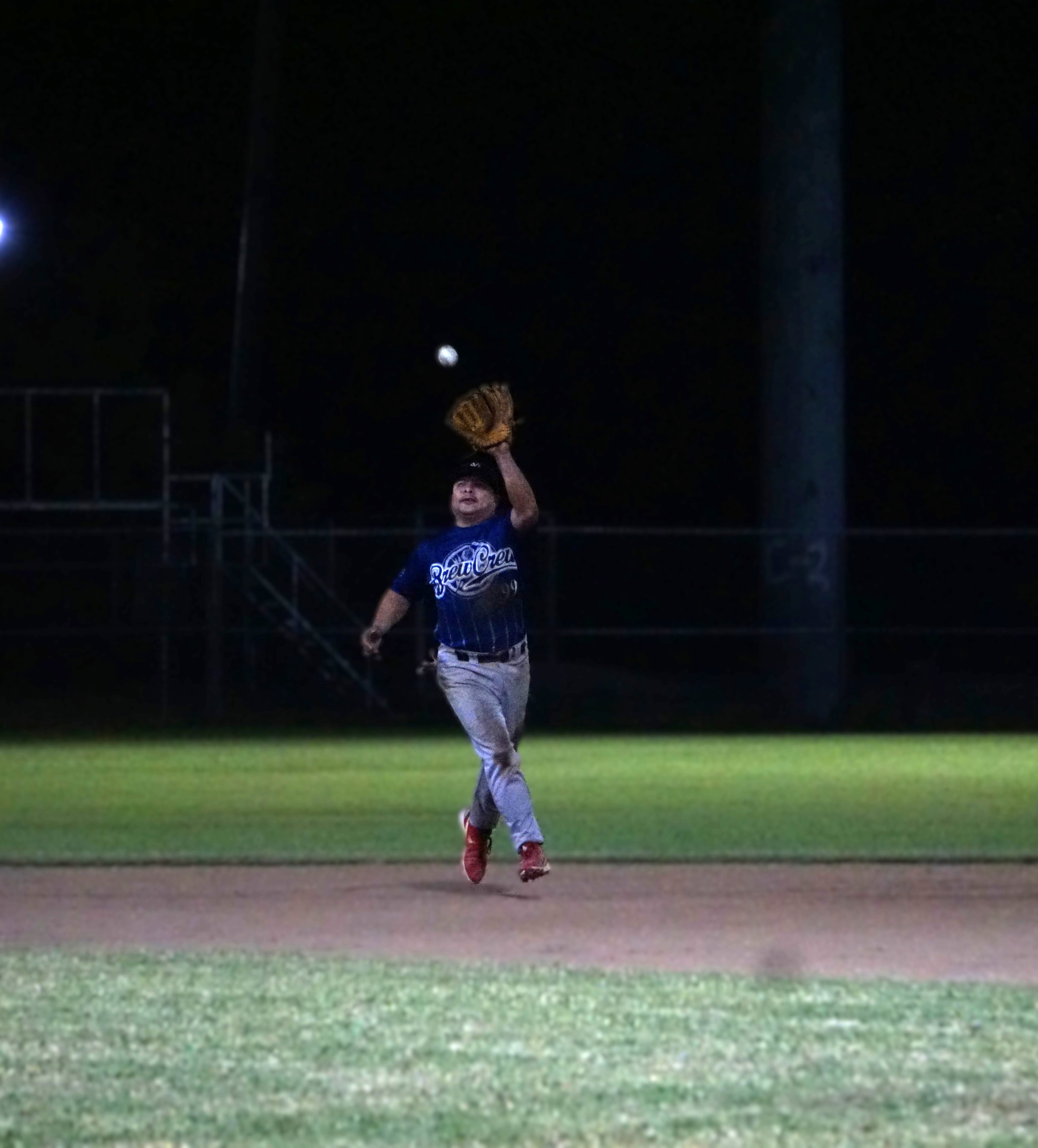 Brewers shortstop Jerome Delos Santos catches a flyball during a game in the 2024 SBL Masters League at the Francisco “Tan Ko” Palacios Baseball Field.