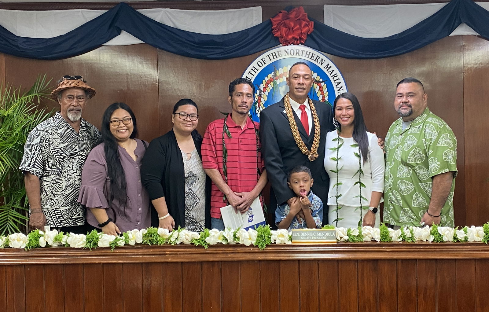 The newly elected Senate president, Rota’s Dennis Mendiola, third right, poses for a photo with his family.