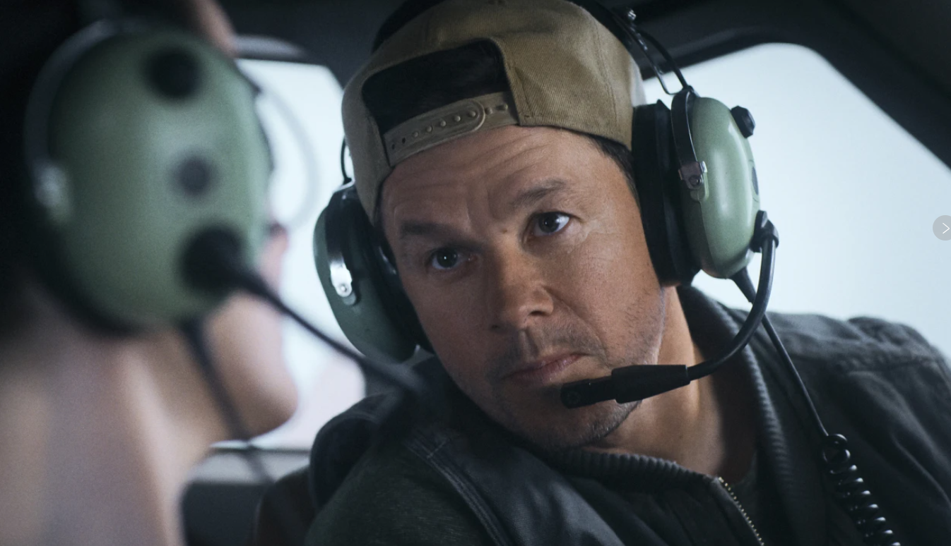 Michelle Dockery, left, and Mark Wahlberg in a scene from “Flight Risk.”