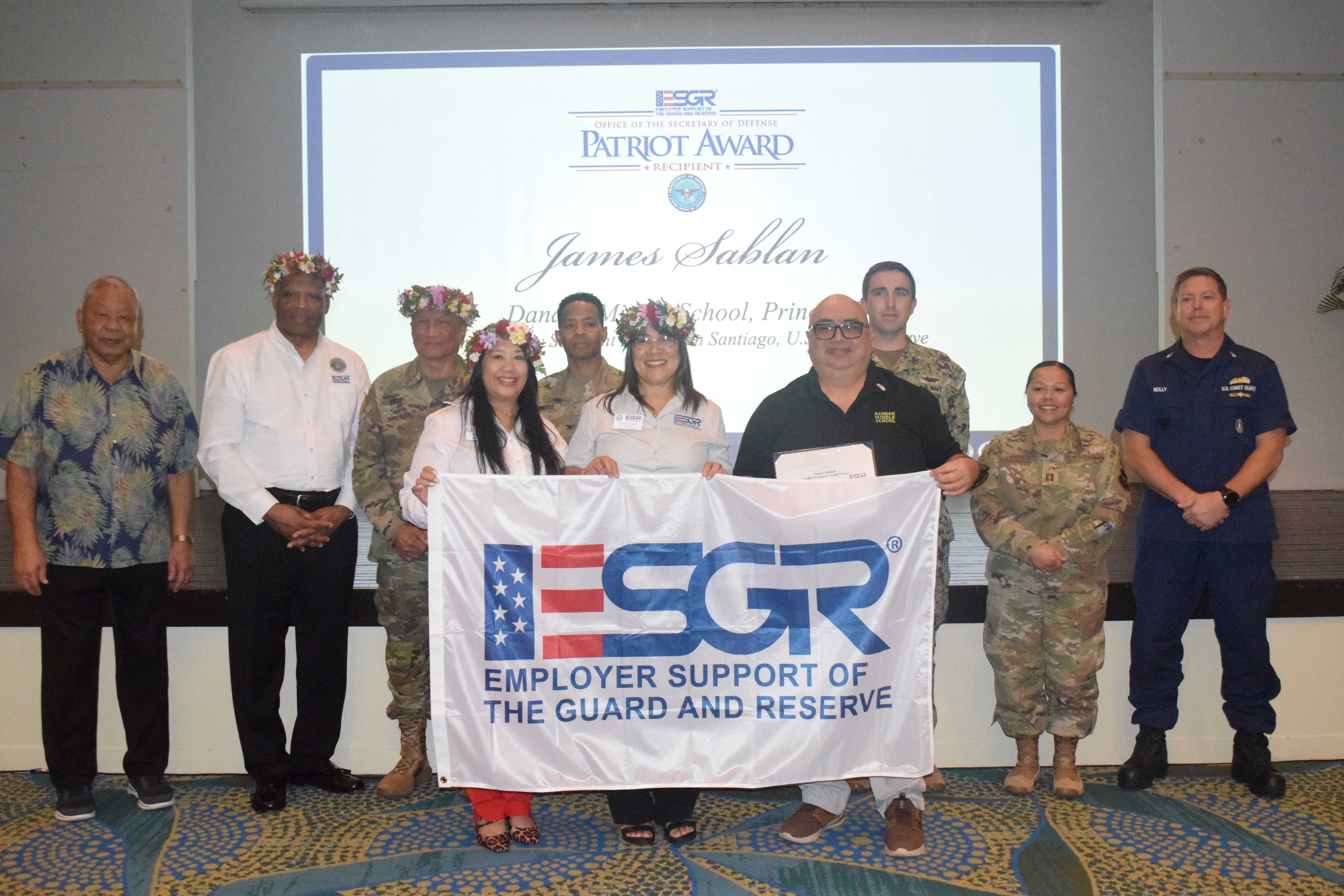 Dandan Middle School Principal James Sablan is pictured with his Patriot Award.