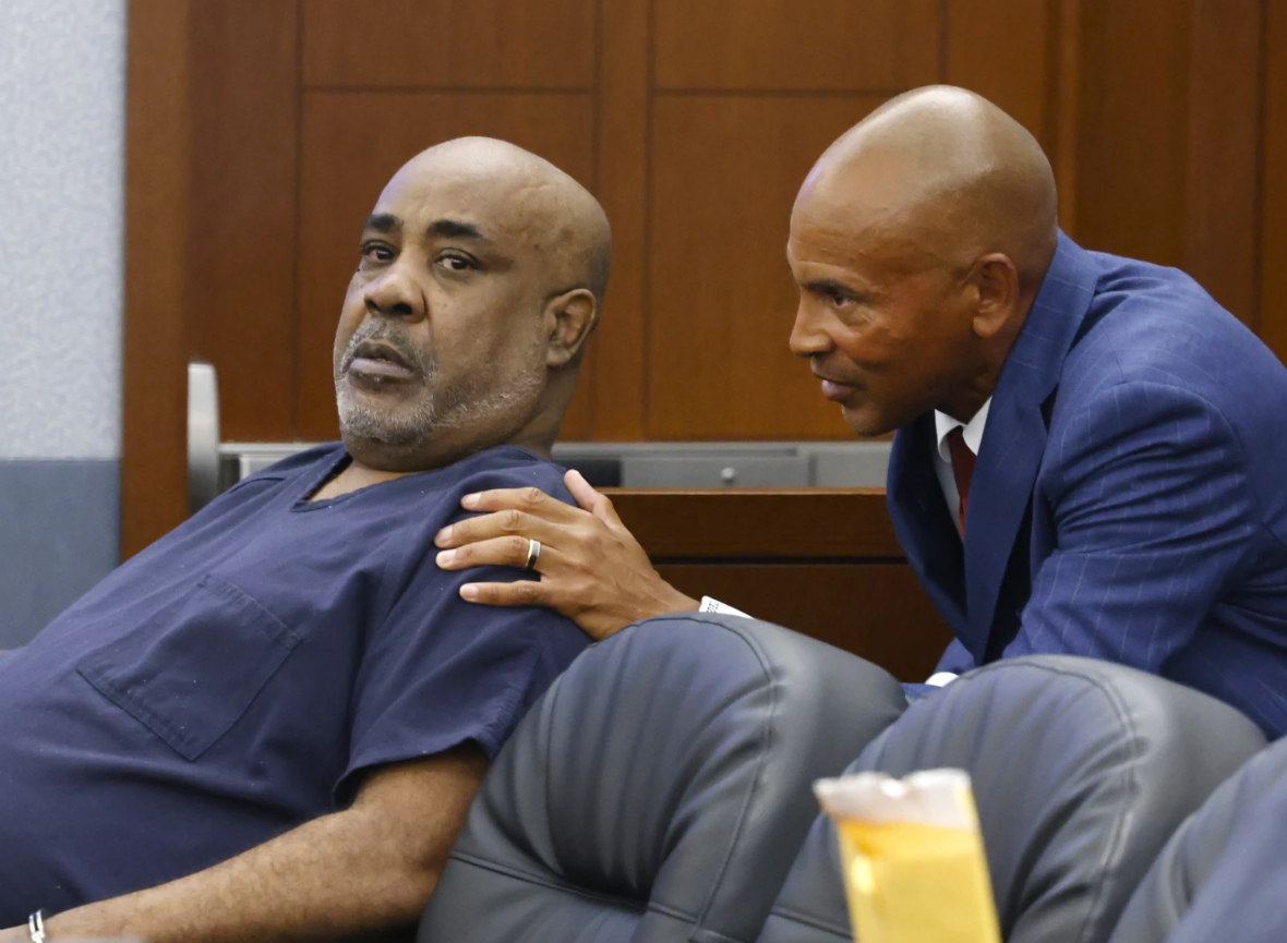 Duane Davis, left, listens to his attorney Carl Arnold during a hearing at the Regional Justice Center on July 23, 2024 in Las Vegas.