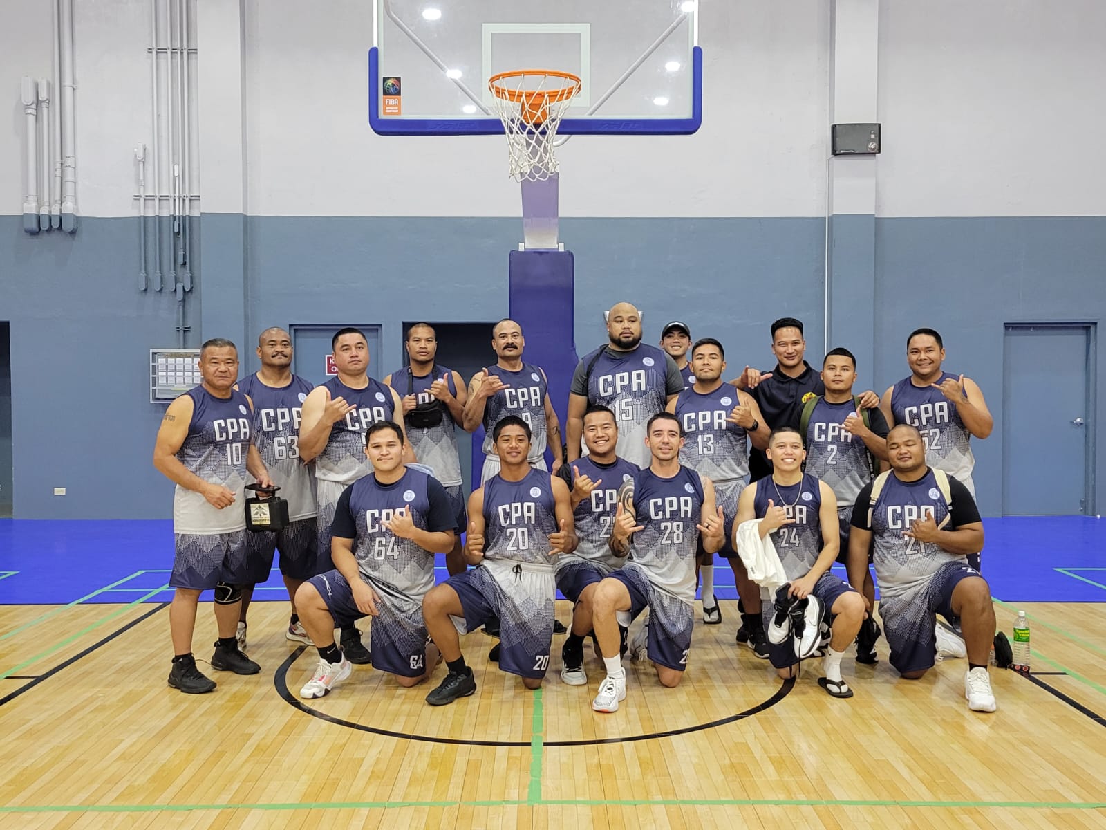 CPA players pose for a group photo after winning a game in the 2024 R&J Wine and Liquor Inter-Government/Business League at the Ada gym.