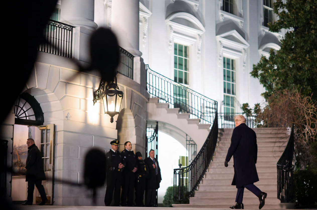 President Donald Trump walks as he returns from Florida to the White House, in Washington, D.C. on Jan. 27, 2025.