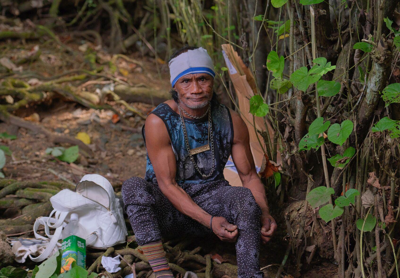 Henry Deruo, an individual experiencing homelessness, is photographed near a Hagåtña bridge on Thursday, Jan. 2, 2025.
