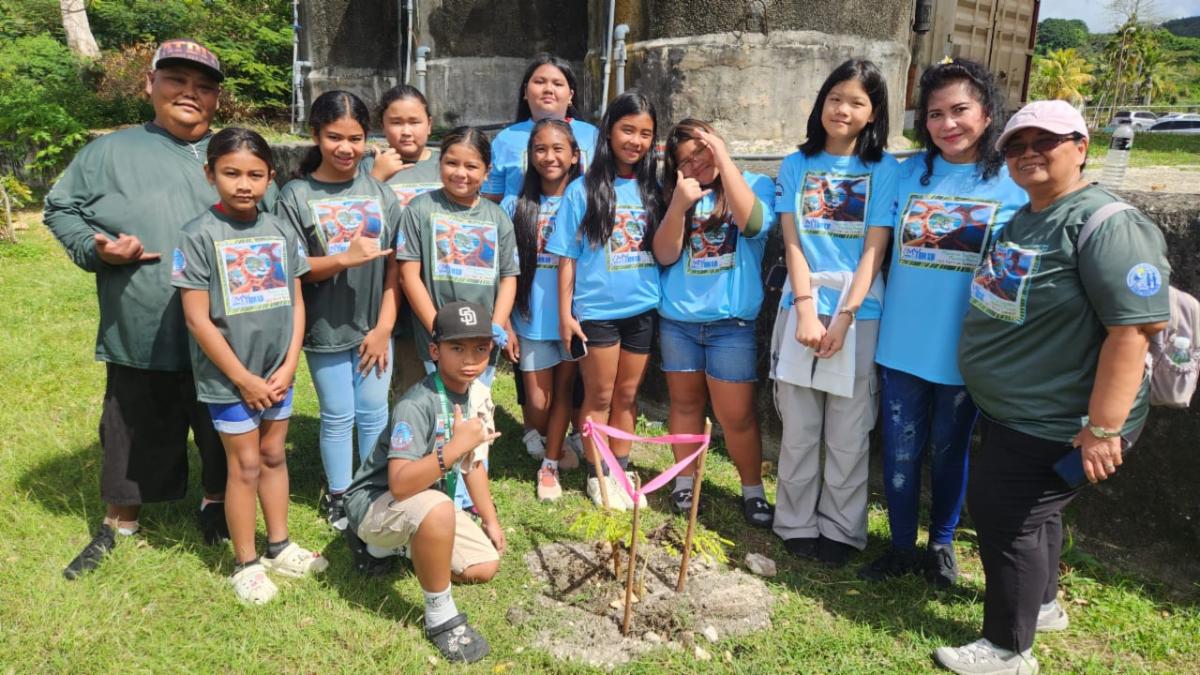 MY WAVE Club students plant a tree at Garapan Central Park in Saipan during the Marianas Tourism Education Council on Jan. 24, 2025. In all, clubs planted five trees at the park.