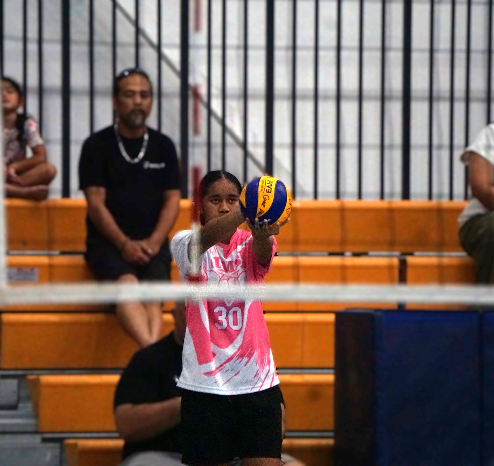 TMS' Aaleyah Fatialofa lines up before attempting an overhead serve.