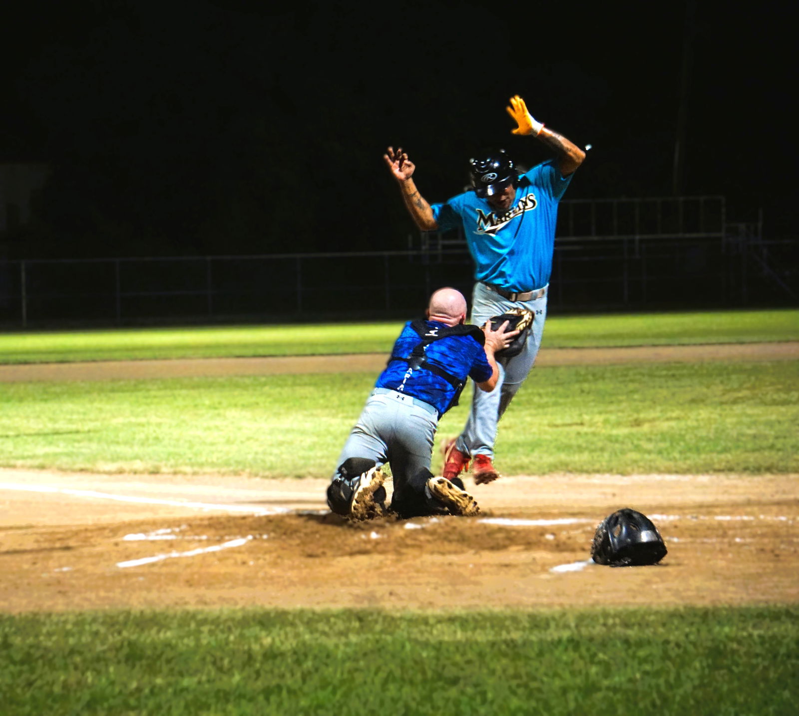 Blue Jays catcher Rick Bauer tags out a runner attempting to score during a game in the 2024 SBL Masters League at the Francisco "Tan Ko" Palacios Baseball Field.