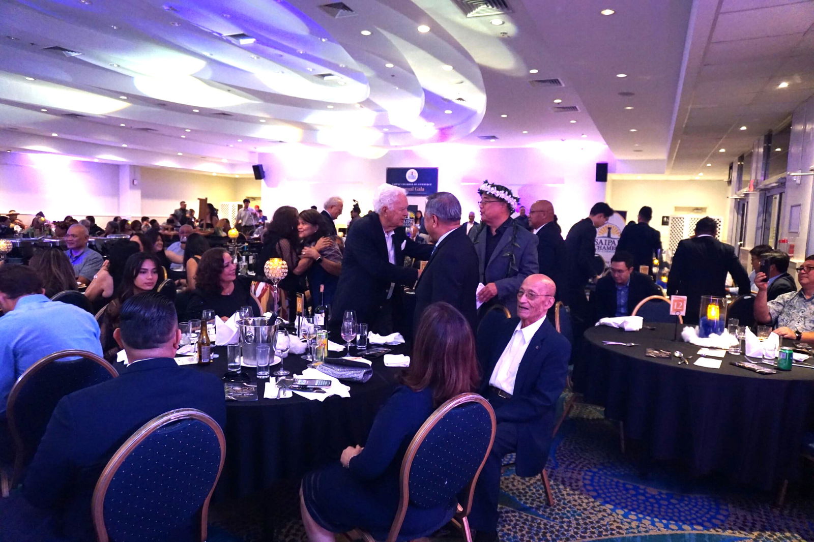 Triple J Saipan Chair and CEO Robert Jones congratulates Frank Ada.