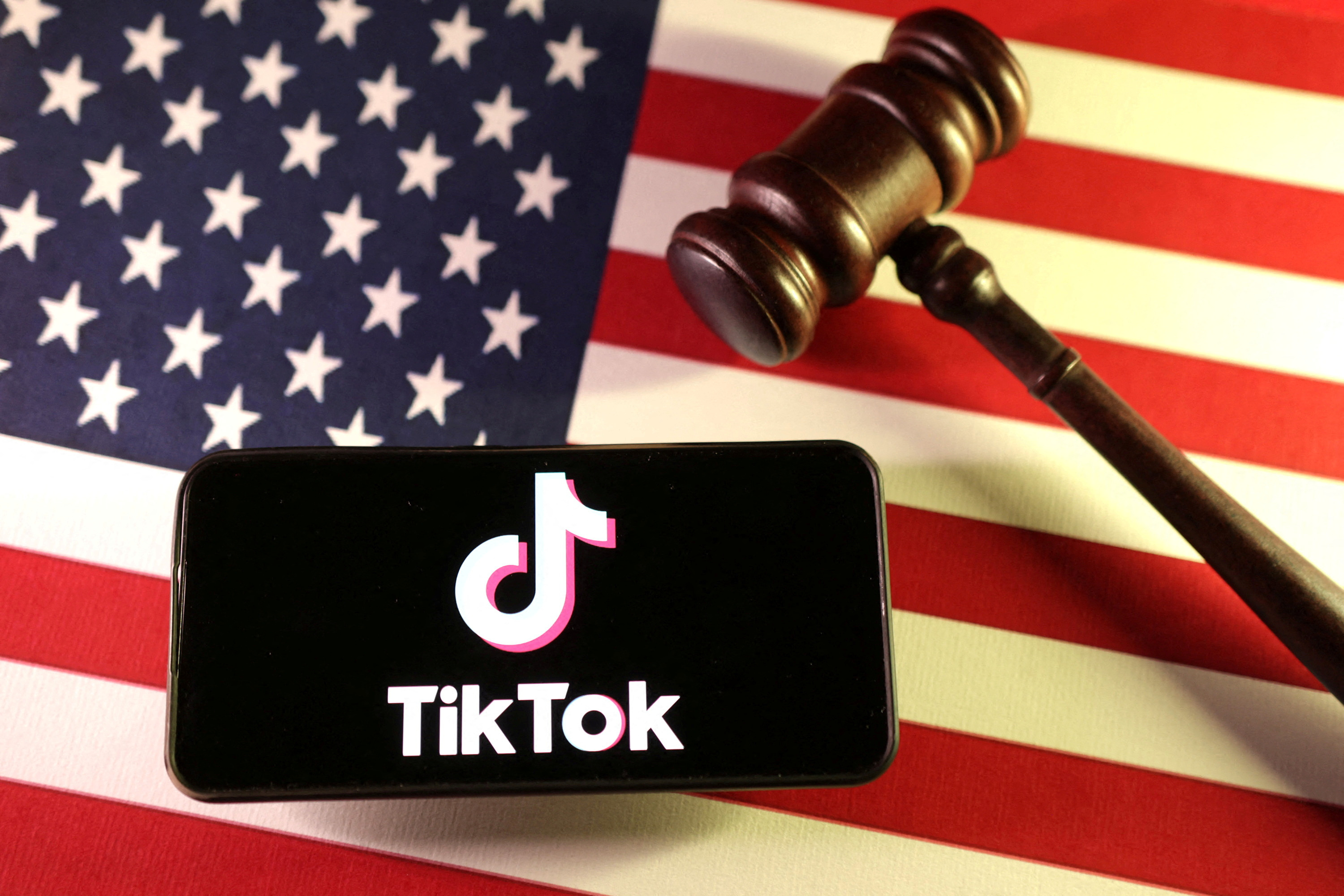 A U.S. flag, the TikTok logo and a gavel are seen in this illustration taken on Jan. 8, 2025. 