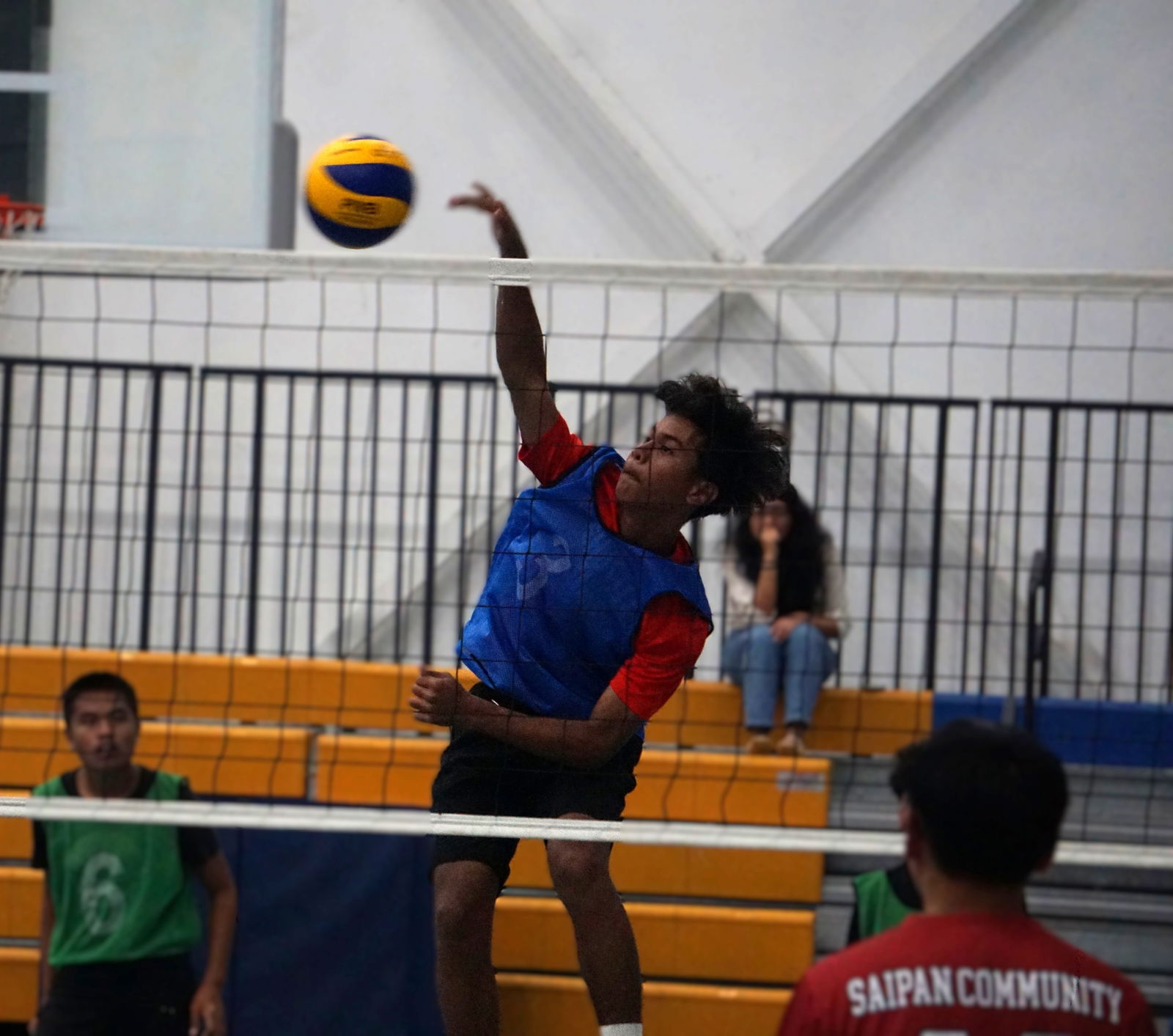 Tanapag Middle School's Peter Camacho connects a spike against Saipan Community School during a boys middle school division match of the PSS-NMIVA Interscholastic Volleyball League SY24-25 at the MHS gym on Tuesday.