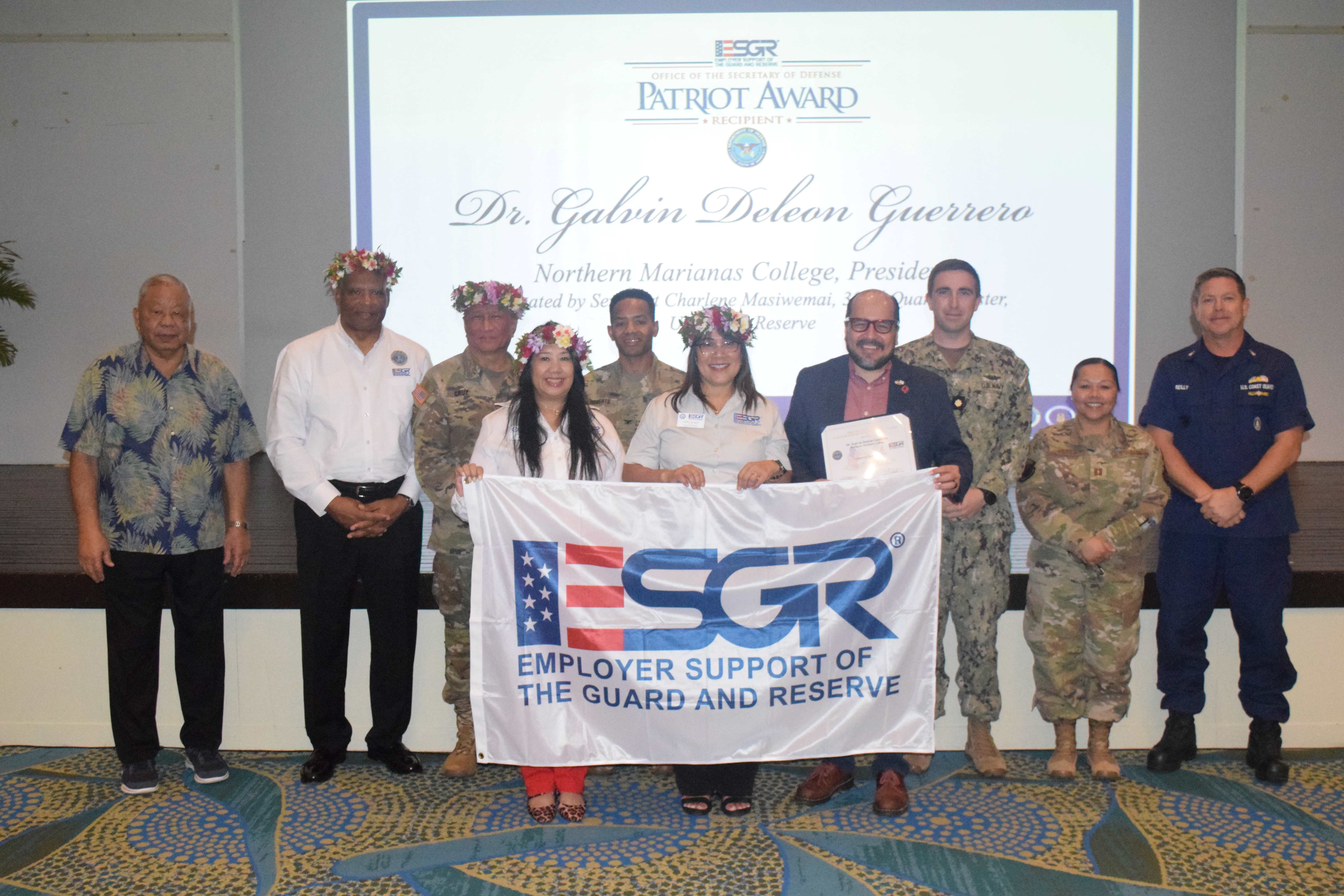 Northern Marianas College President Galvin S. Deleon Guerrero, EdD displays his Patriot Award.